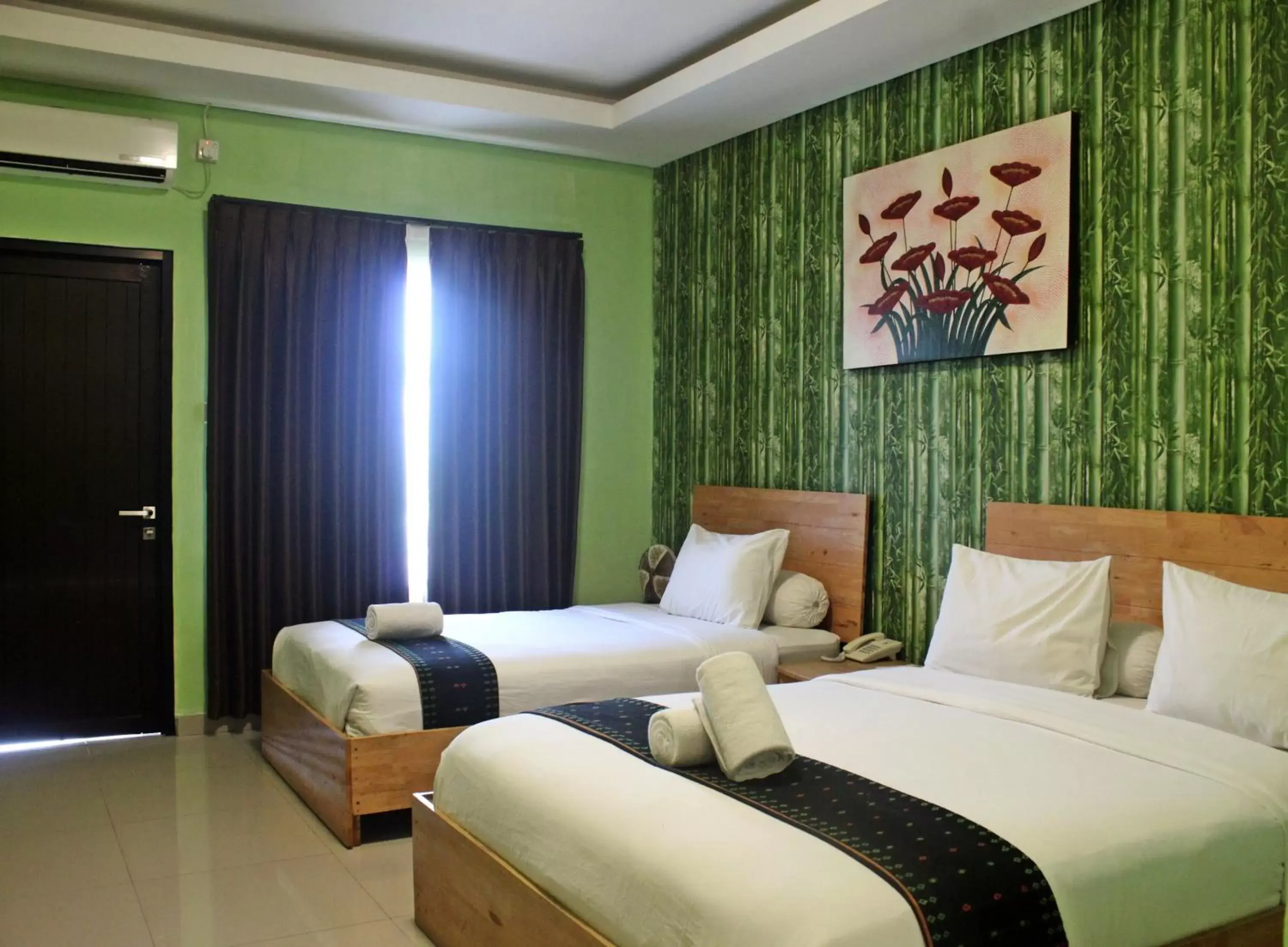 Deluxe Triple Room - Free Return Airport Transfer in Exotic Komodo Hotel Deluxe Triple Room - Free Return Airport Transfer in Exotic Komodo Hotel