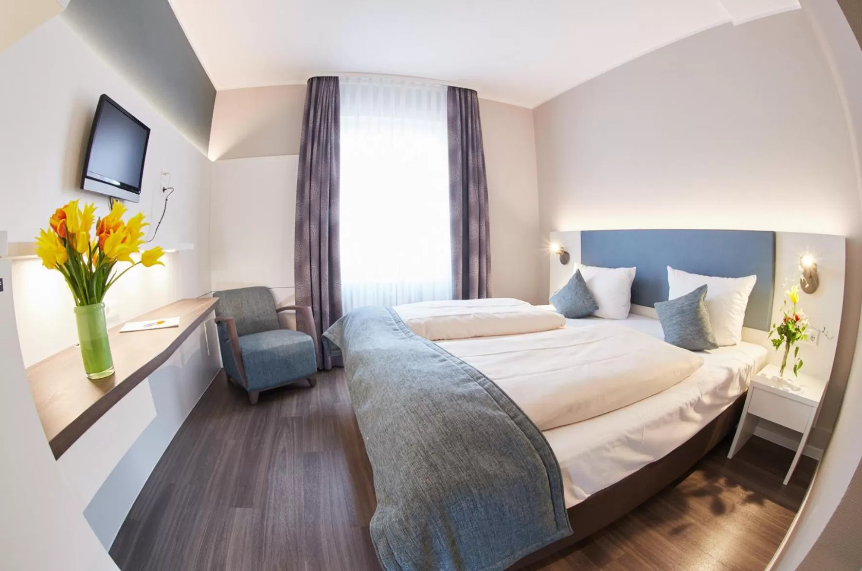 Photo of the whole room, Bed in Stadthotel Freiburg Kolping Hotels & Resorts