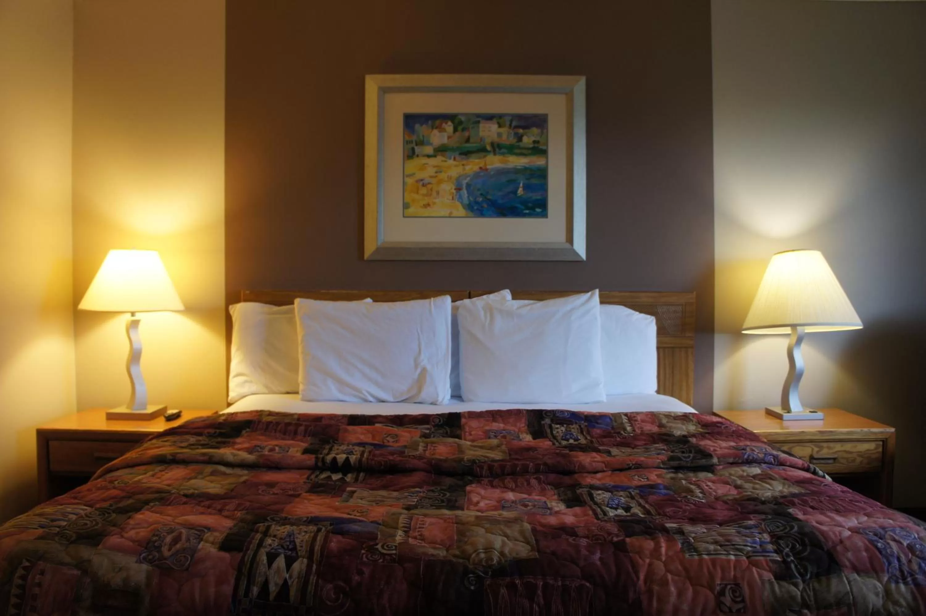 Bed in Coratel Inn and Suites Maple Grove