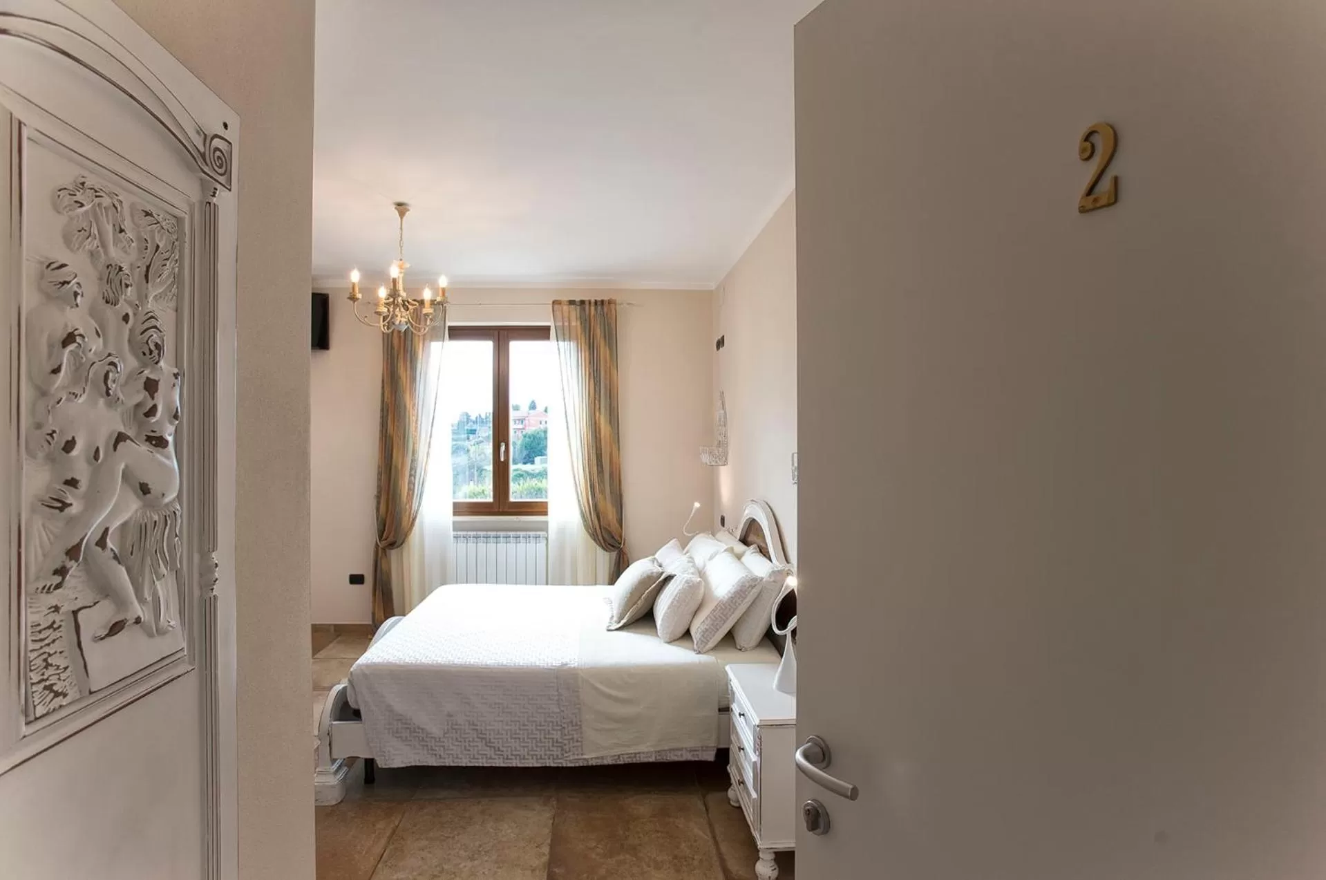 Photo of the whole room, Bed in Villa Malvasio Pool and Jacuzzi Room Sassari