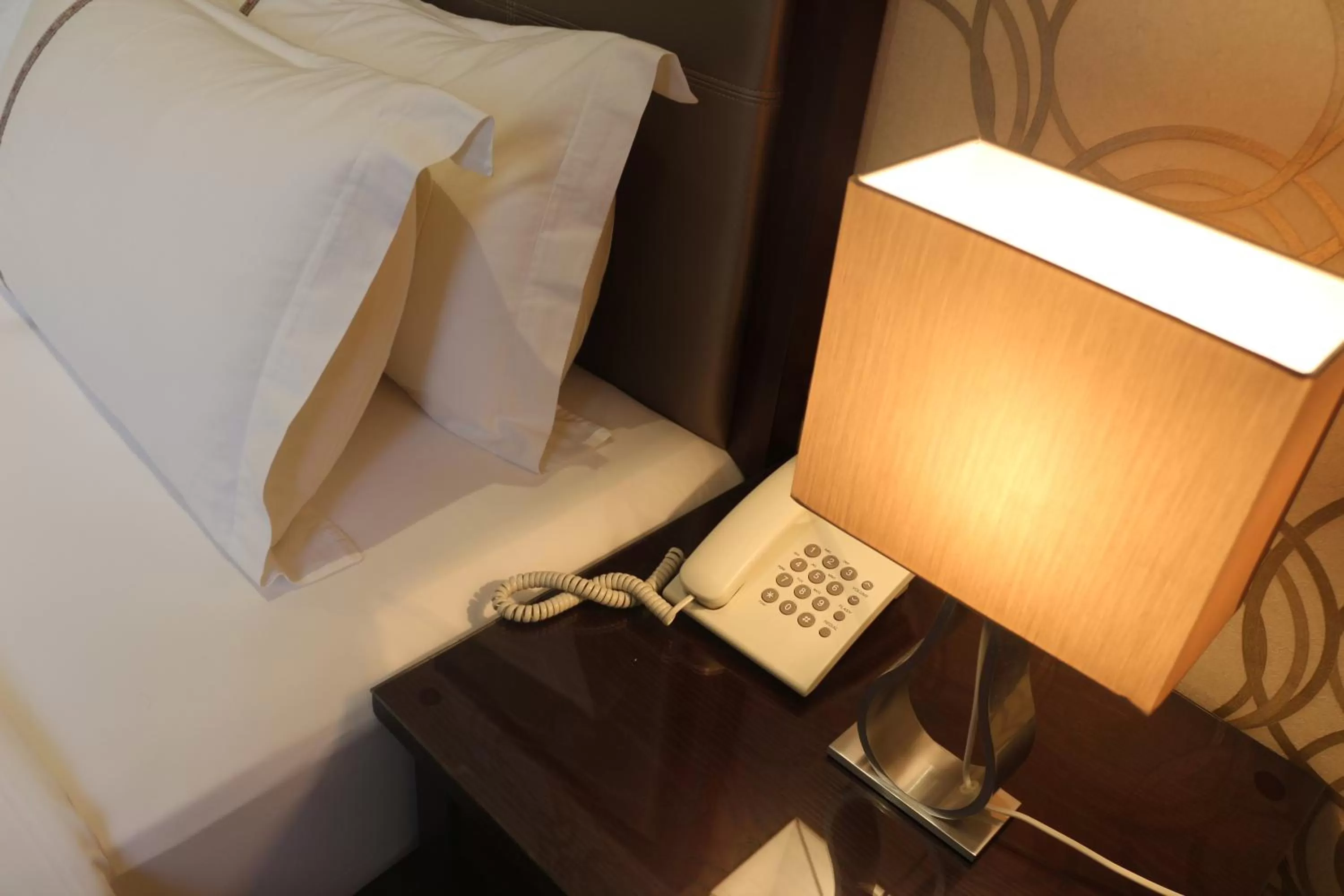 Bed in Nooryana Suites and Apartments