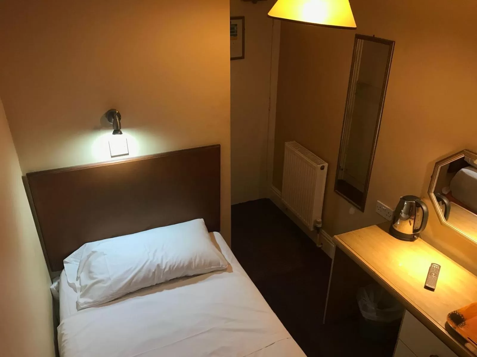 Bed in Ambassador Hotel