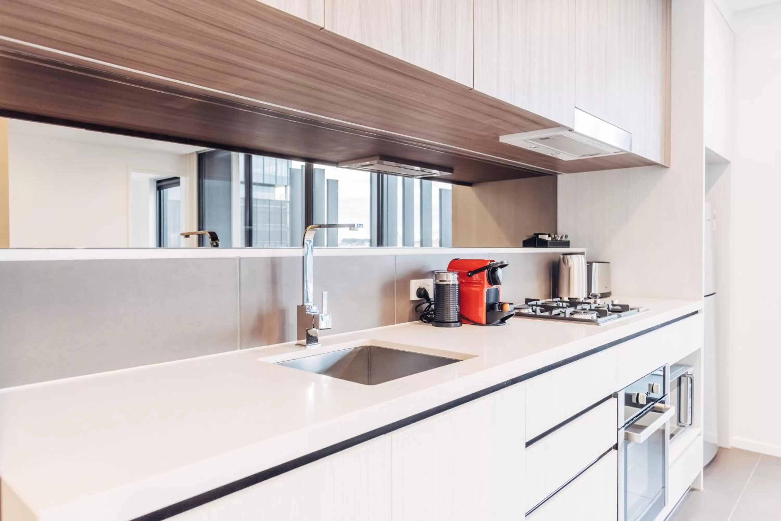 Kitchen or kitchenette in Comfort Apartments Box Hill