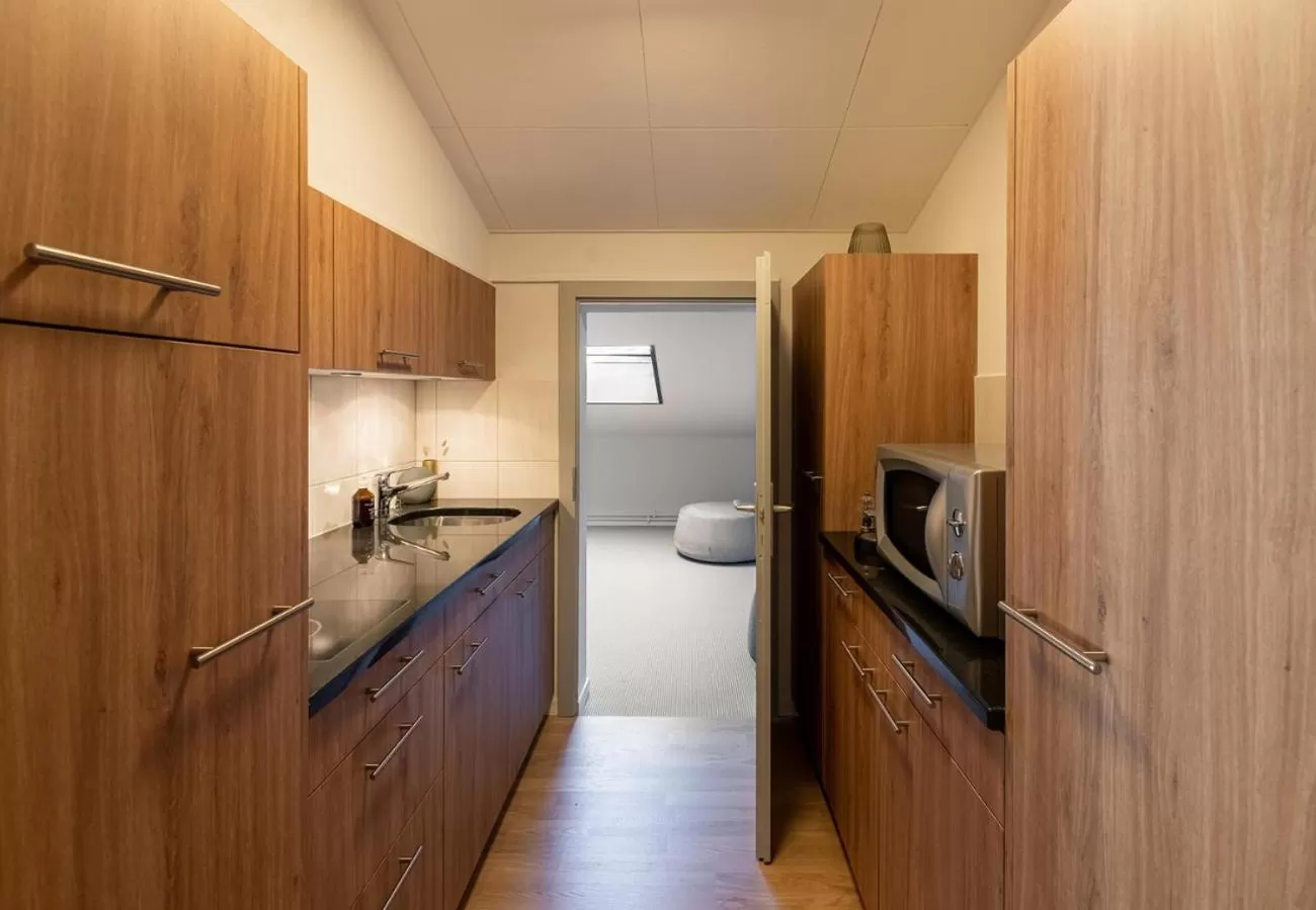 Kitchen or kitchenette in Victoria Hotel & Residence