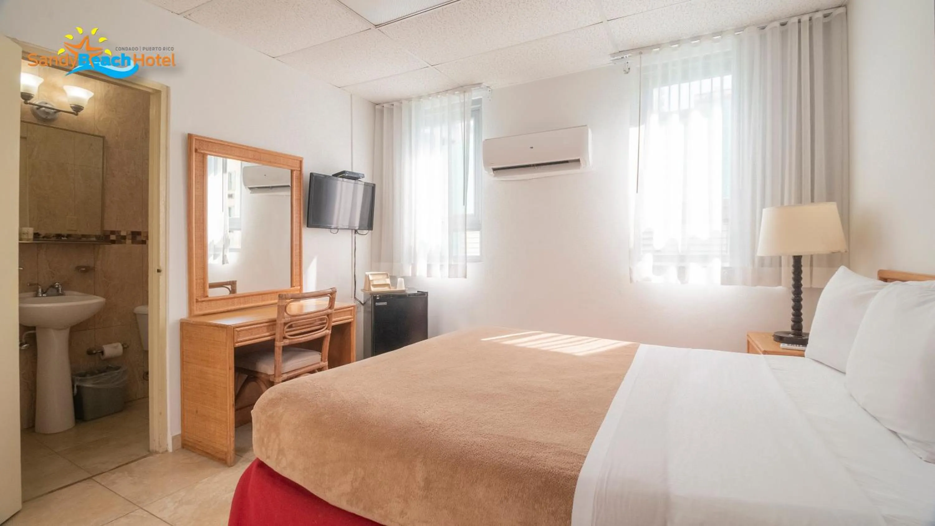 Toilet, Bed in Sandy Beach Hotel