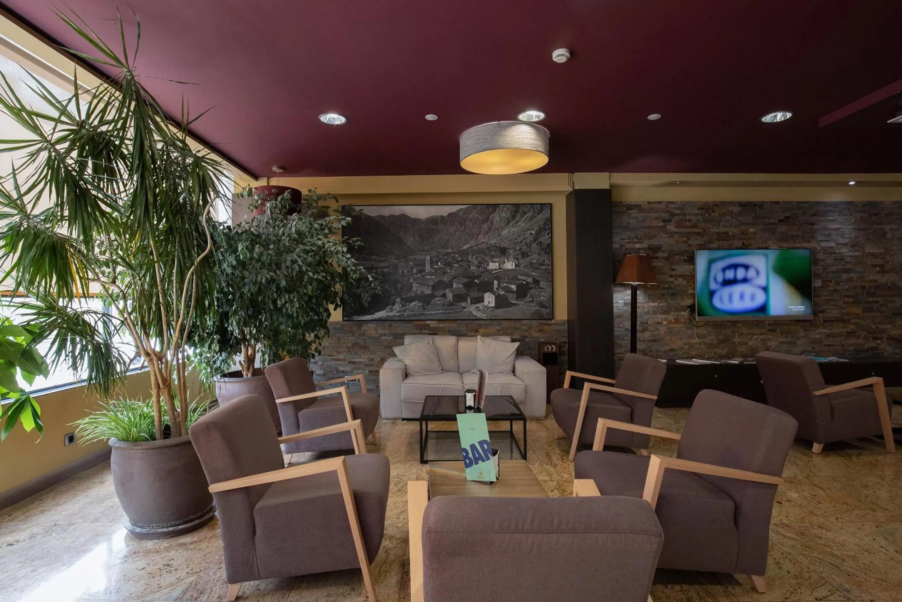 Communal lounge/ TV room in Hotel Màgic Andorra by Nexta