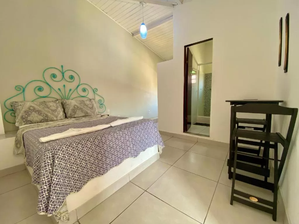 Photo of the whole room, Bed in Pousada Porto Búzios