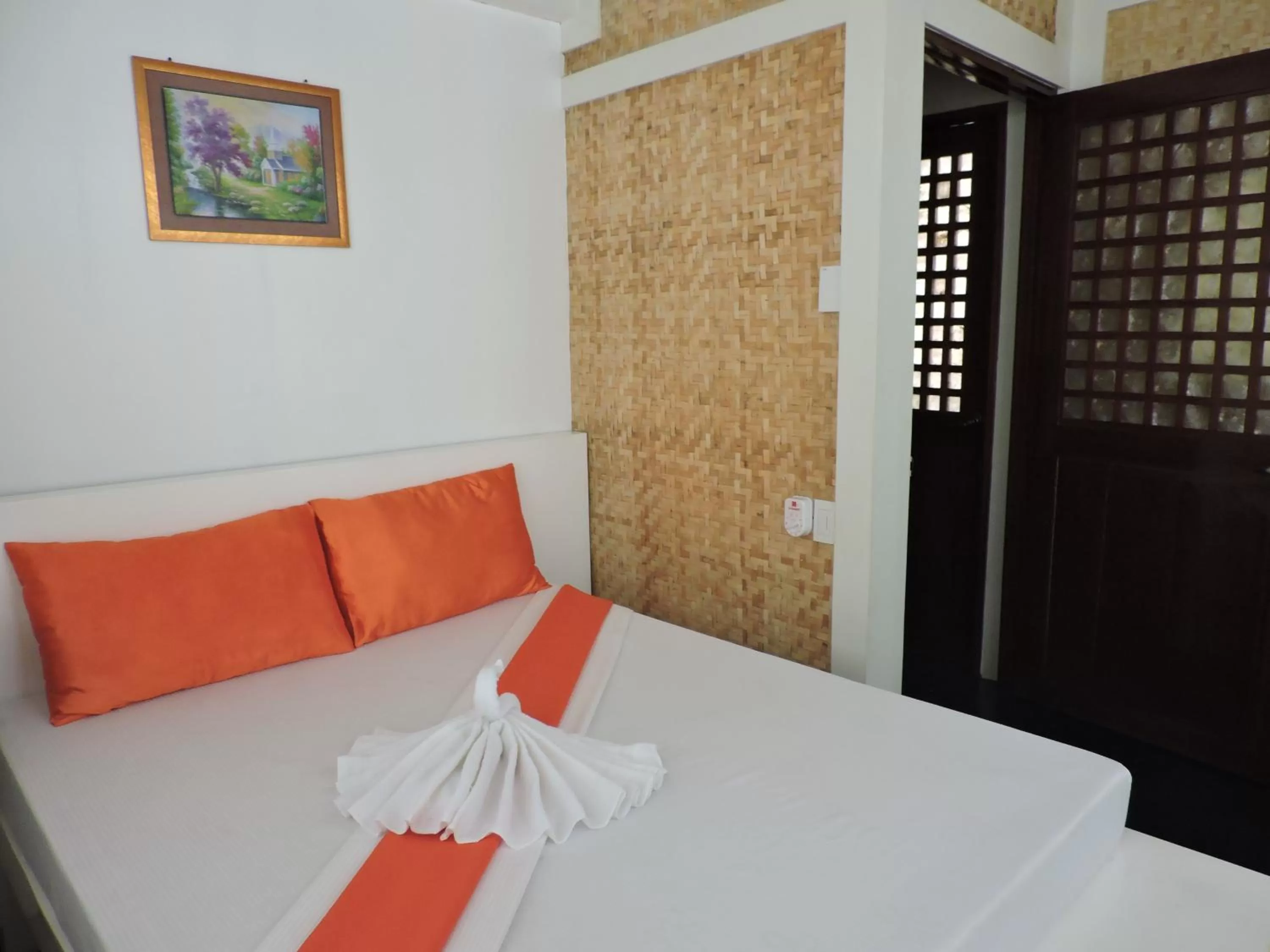 Photo of the whole room, Bed in Orange Mangrove Pension House by SMS Hospitality