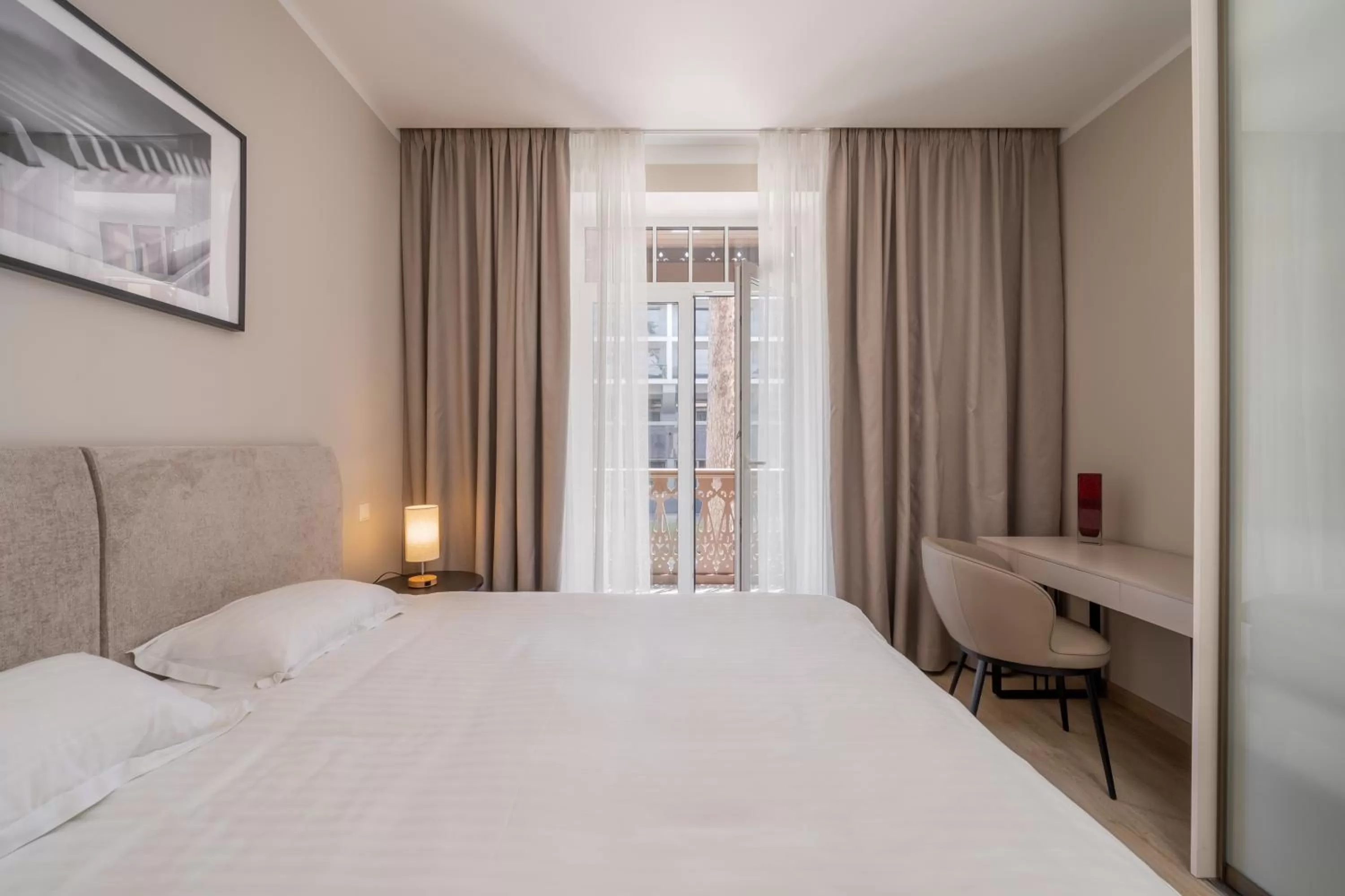 Bed in STORIES Design ApartHotel