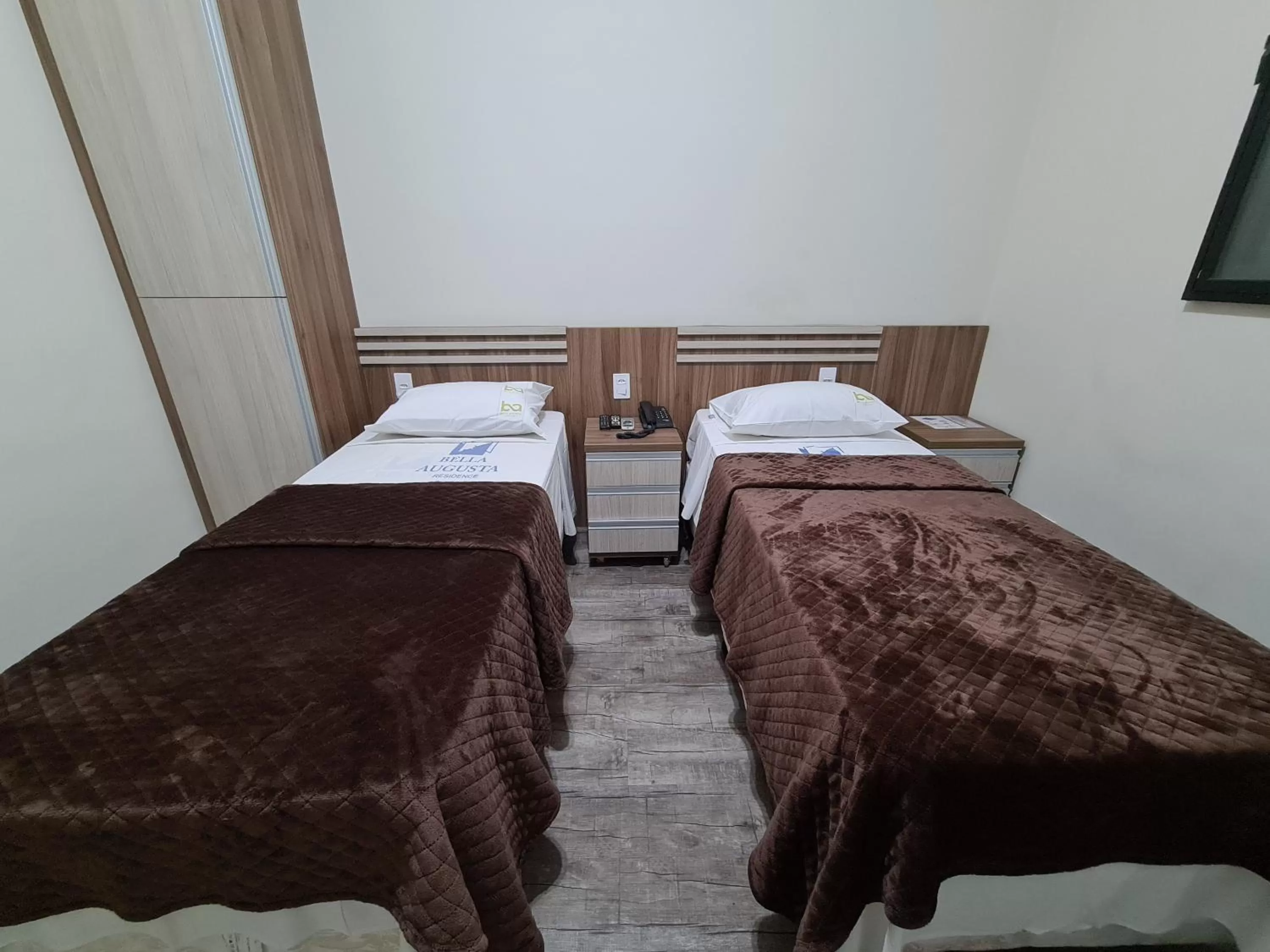 Bed in Bella Augusta Hotel