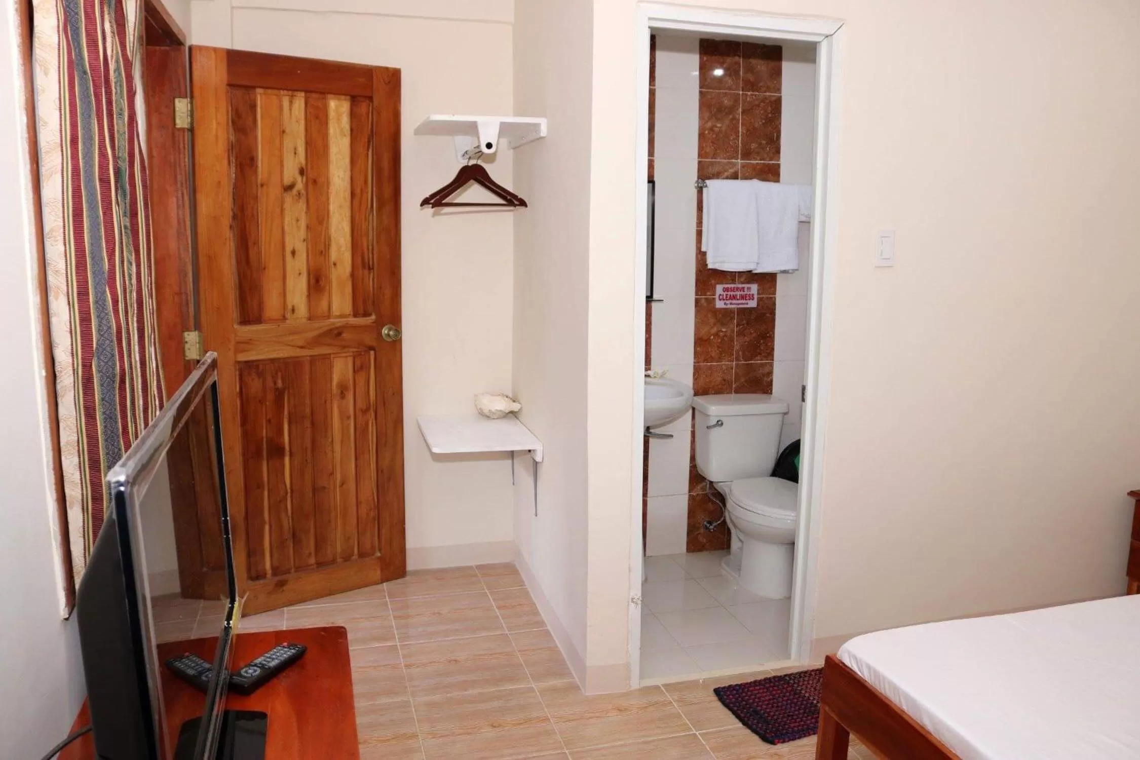 Toilet, Bed in D's Oceanview Beach Resort