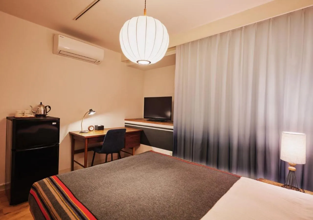 Bed in Hotel Graphy Nezu