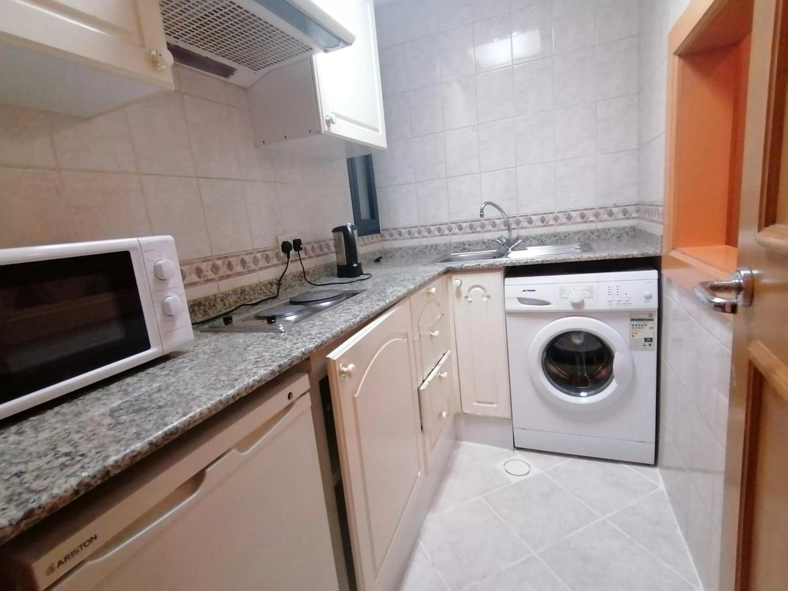 Kitchen or kitchenette in Welcome Hotel Apartments 1