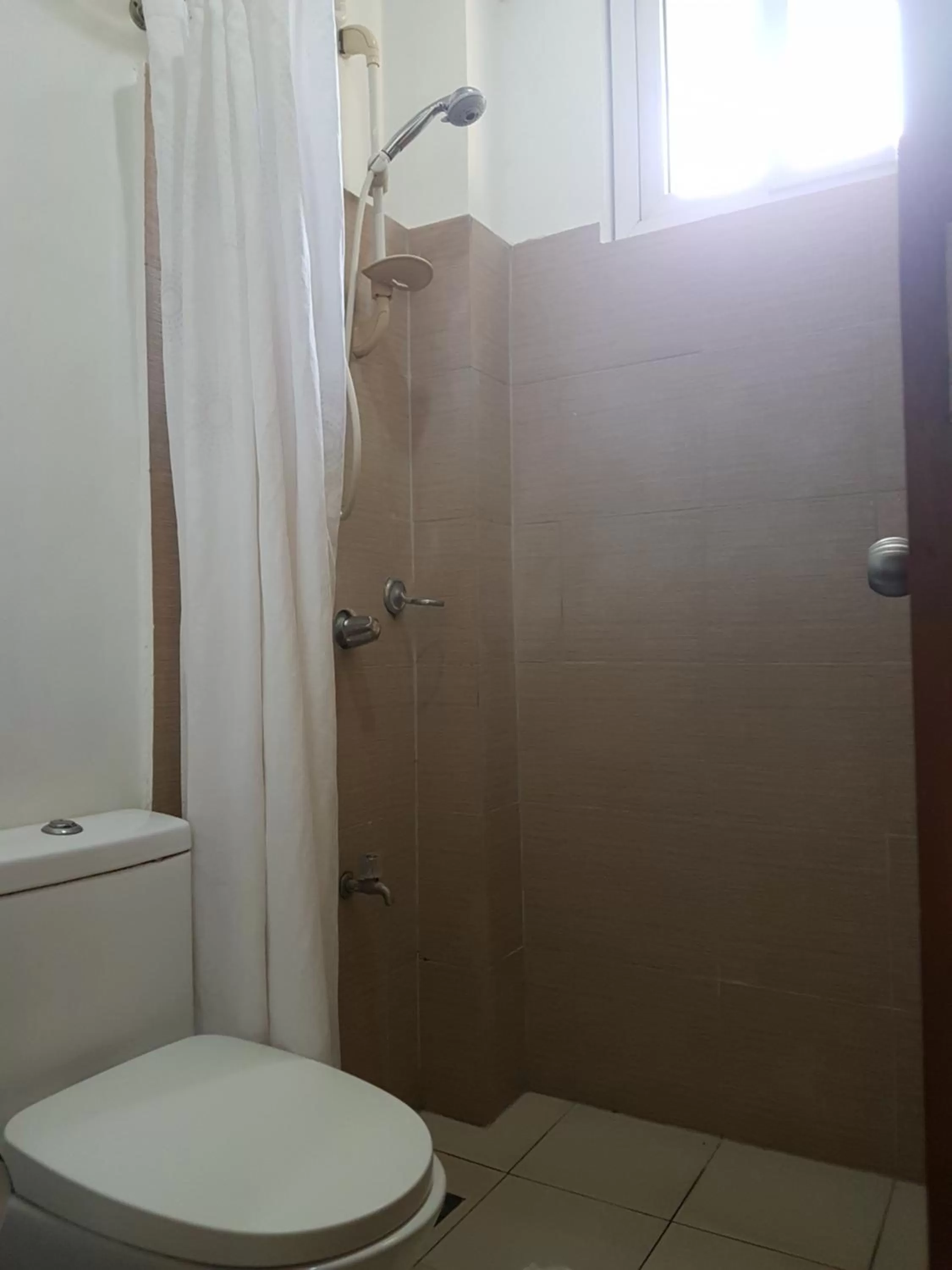 Toilet in Blue Lagoon Inn & Suites