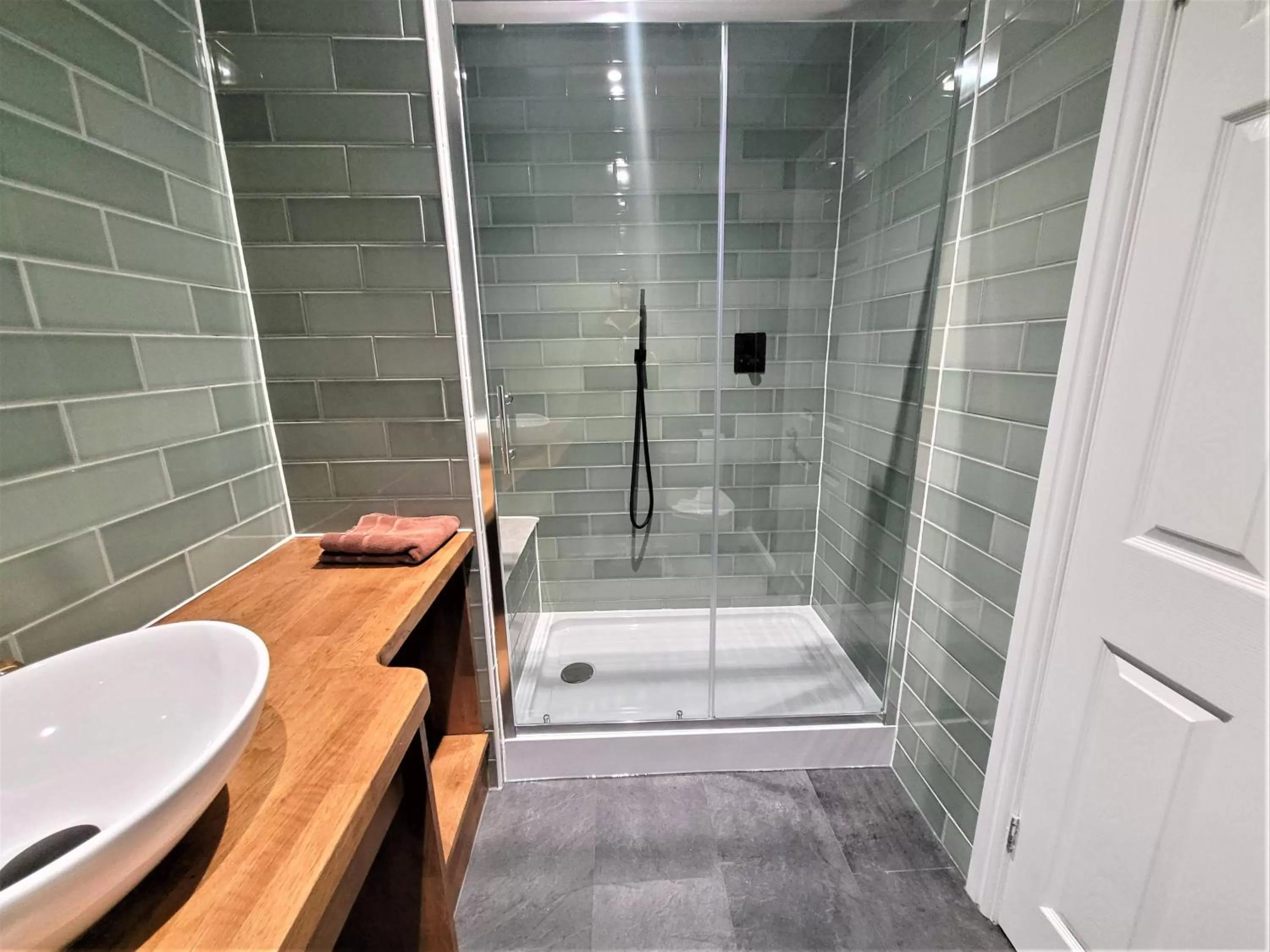 Shower in New County Hotel & Serviced Apartments by RoomsBooked