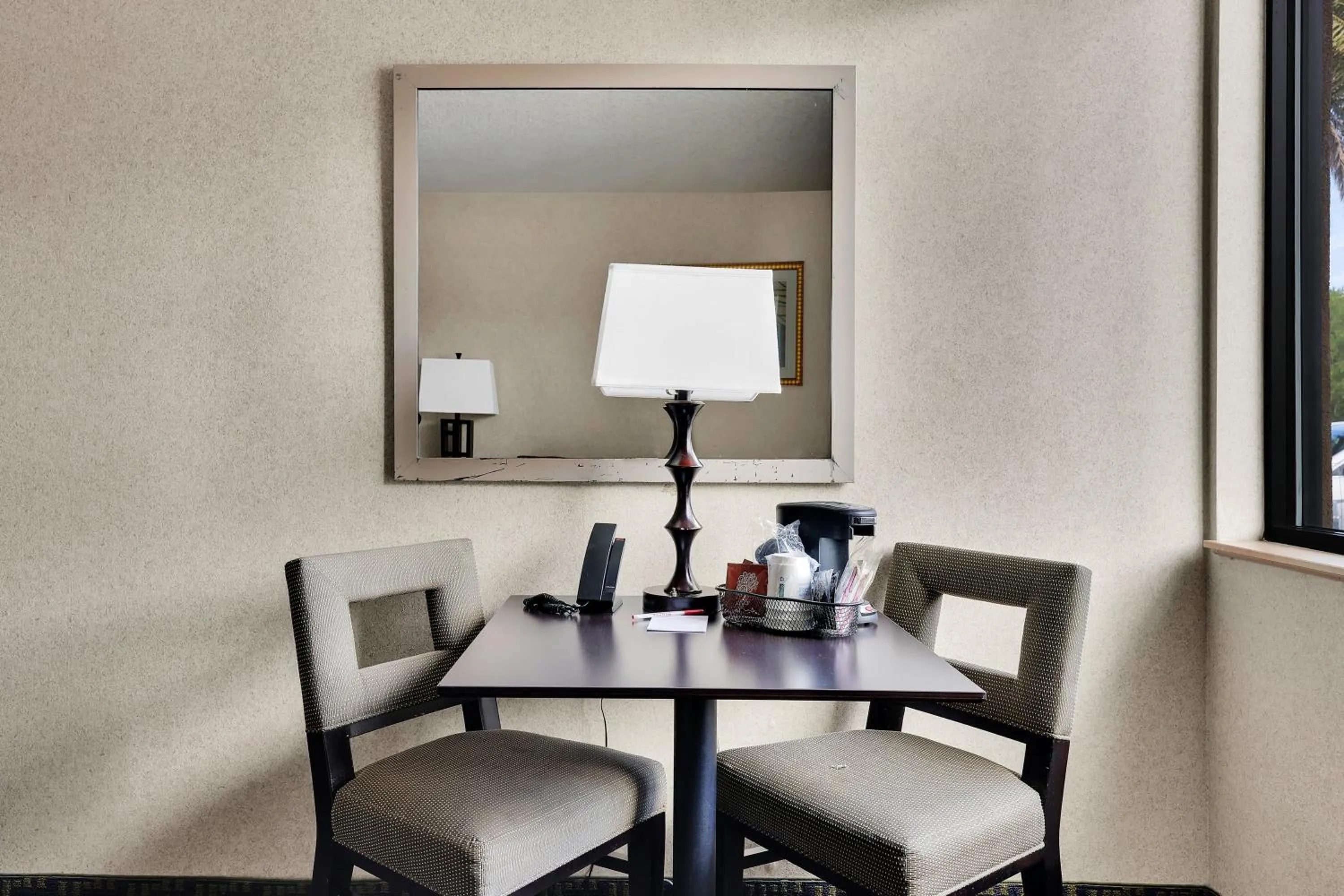 Seating area in Ramada by Wyndham Jacksonville I-95 by Butler Blvd