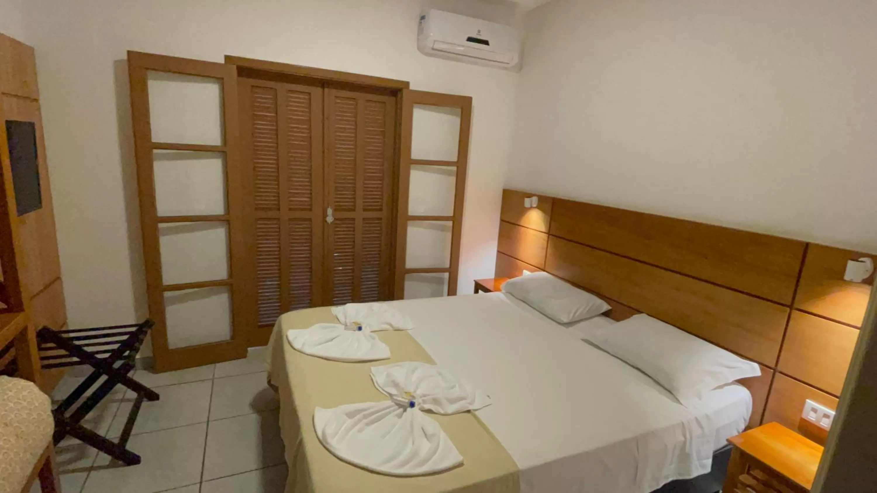 Bed in Pousada Ilha Vitoria