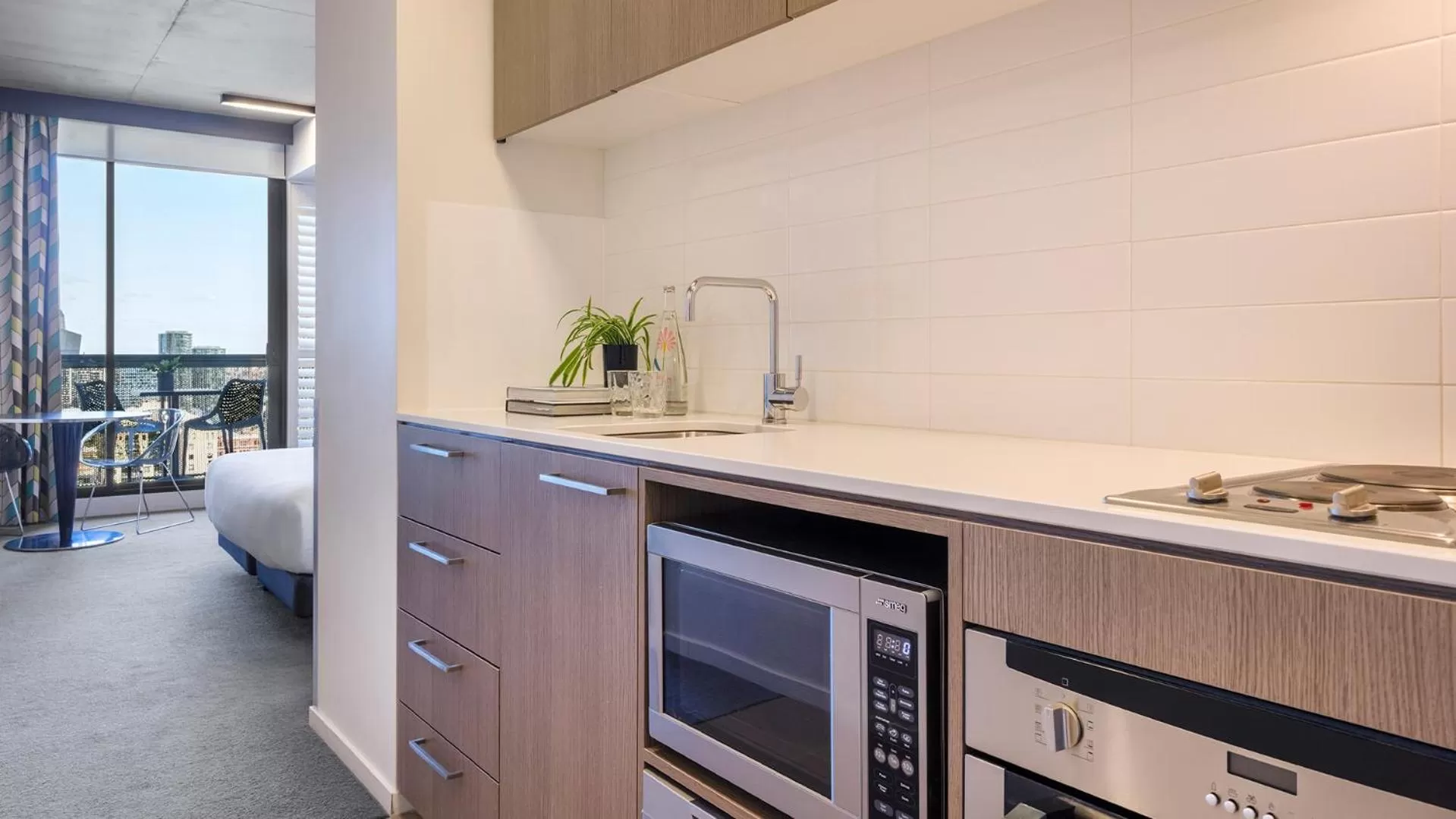 Kitchen or kitchenette in Oaks Melbourne on William Suites