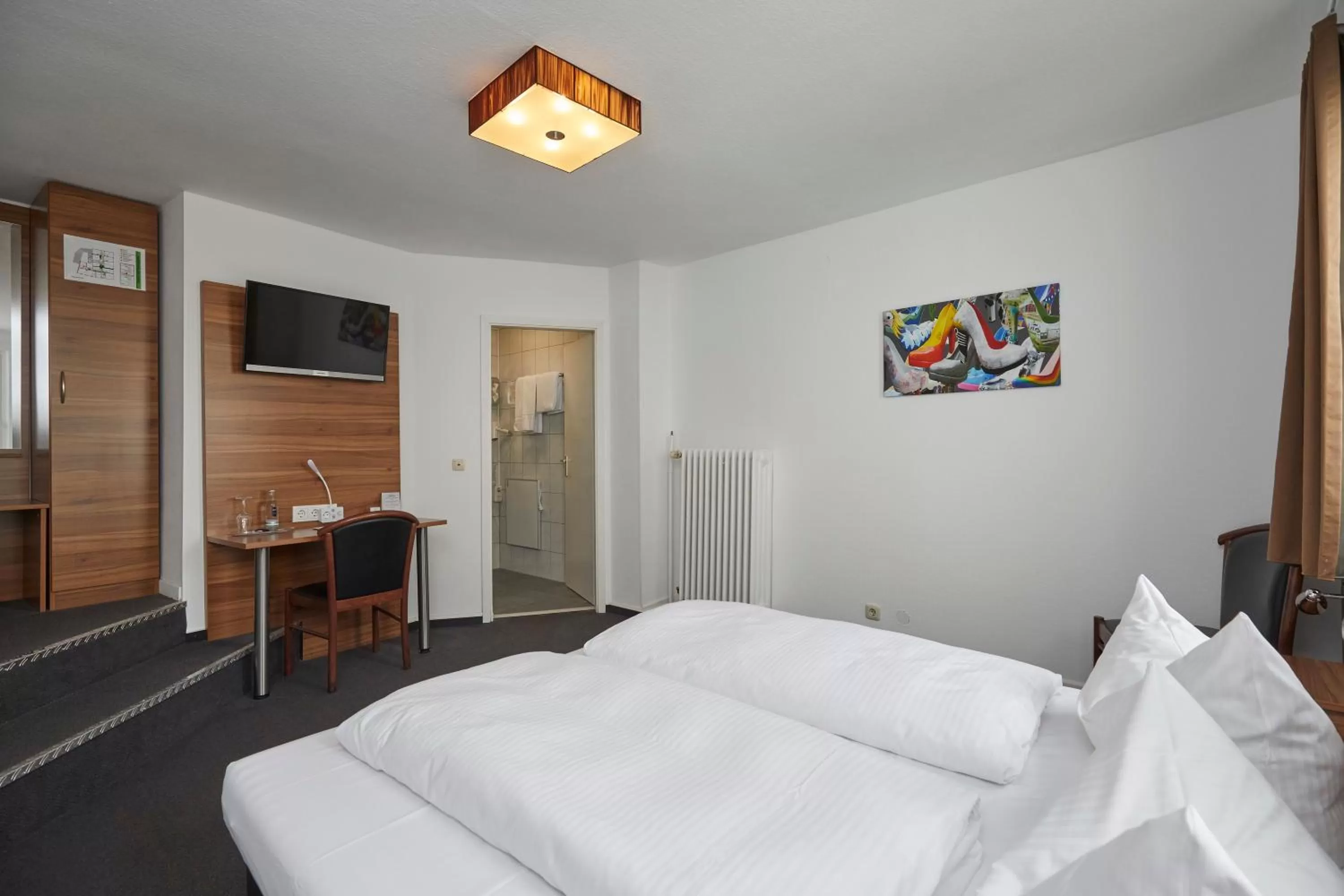 Photo of the whole room, Bed in Hotel Schlemmer Das familäre Altstadt - Hotel mit Herz