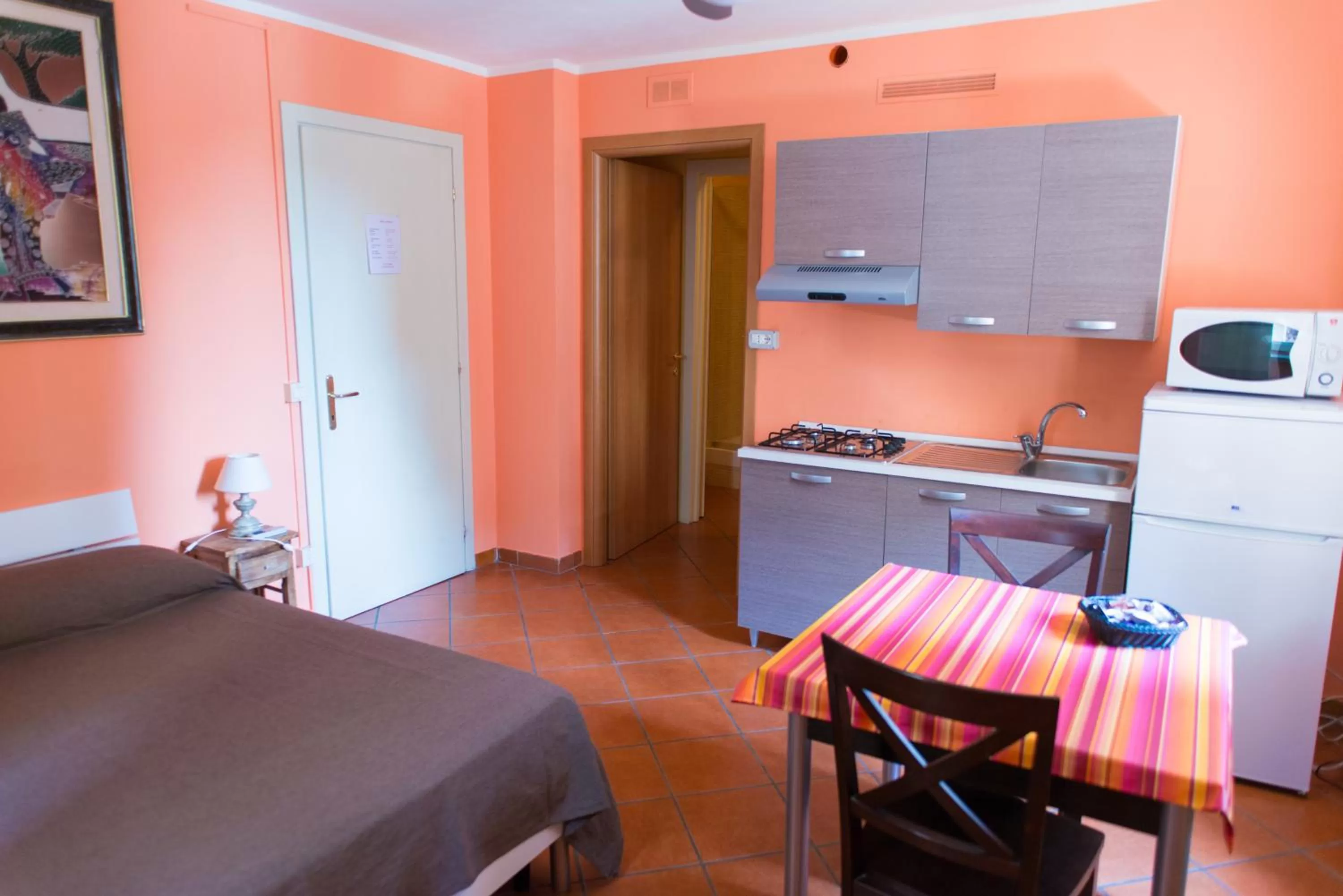 Kitchen or kitchenette, Bed in Al Cardinale Rooms & Studios