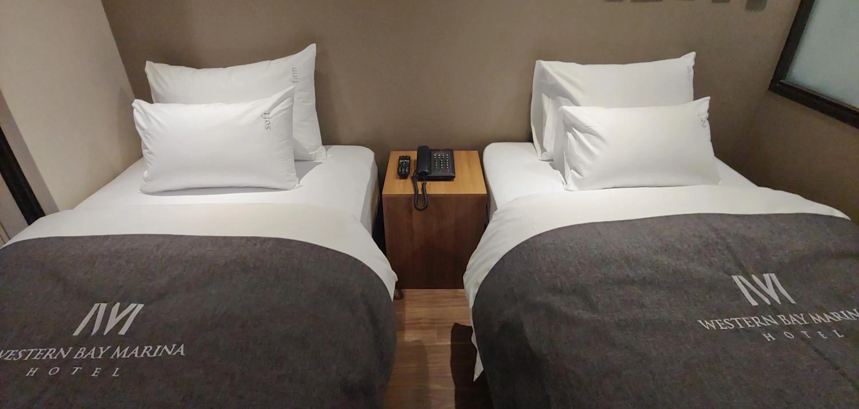 Bed in Western Bay Marina Hotel