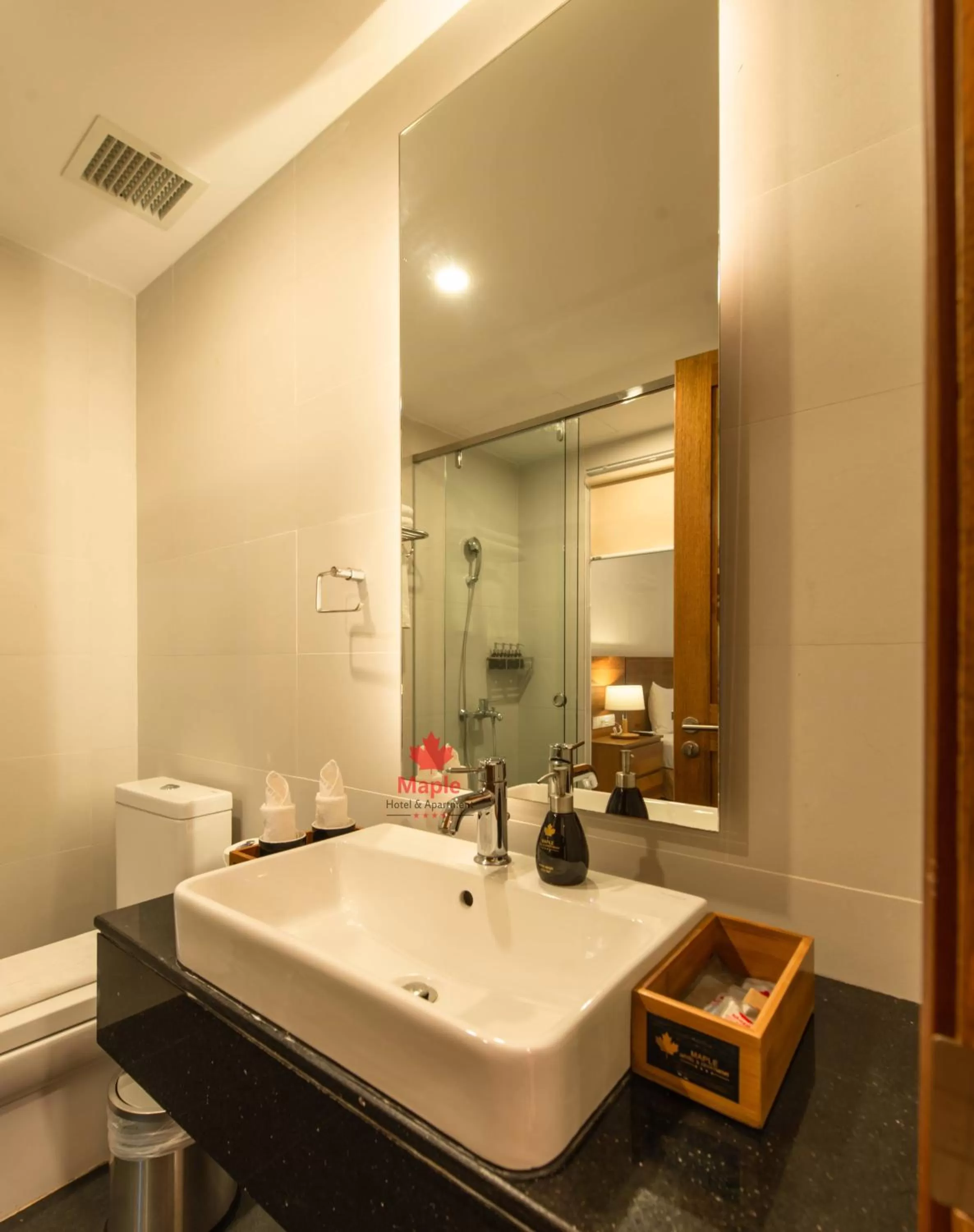 Toilet in Maple Hotel & Apartment