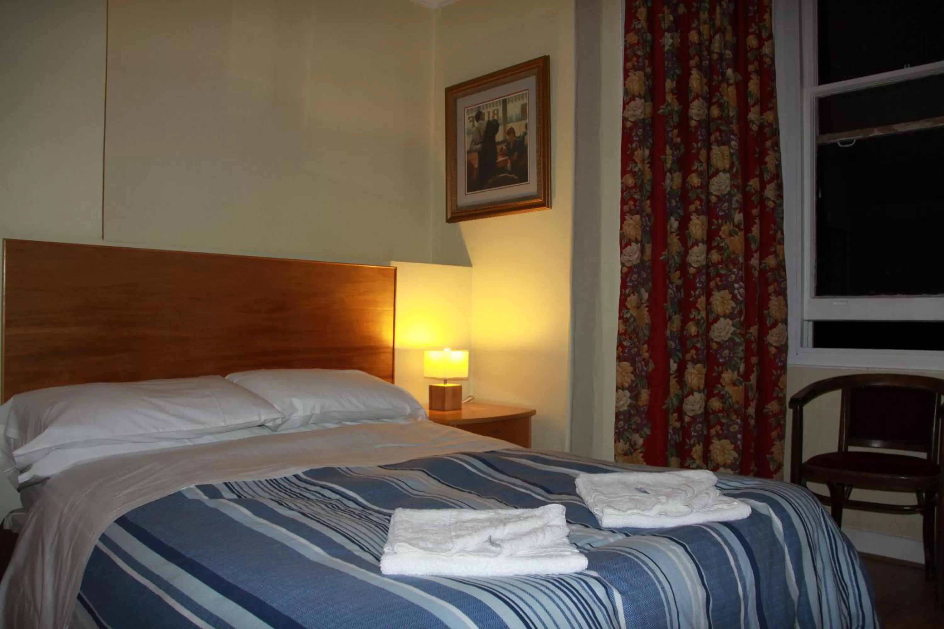 Bed in Ambassador Hotel