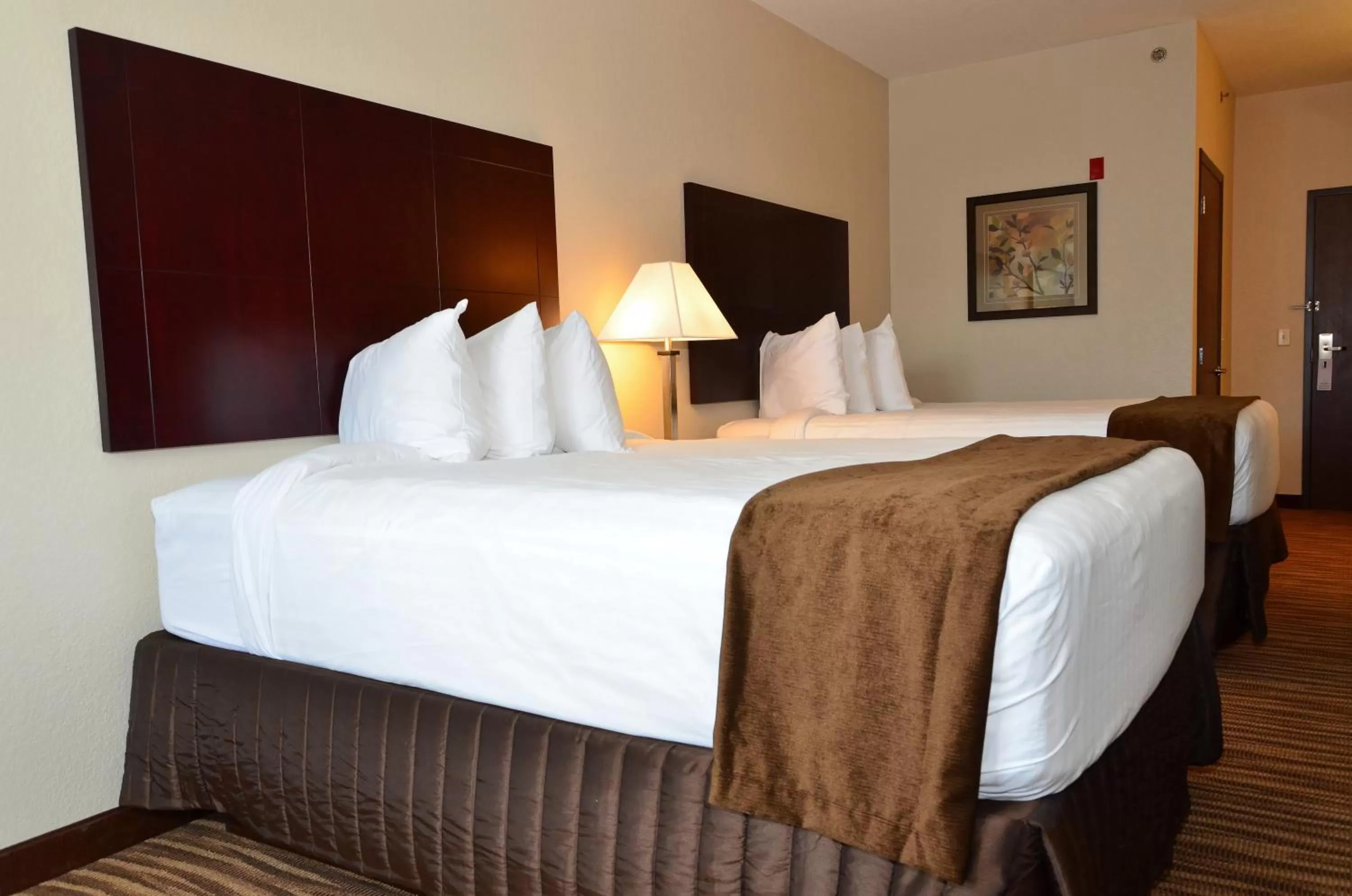 Bed in Cobblestone Inn & Suites - Clarion