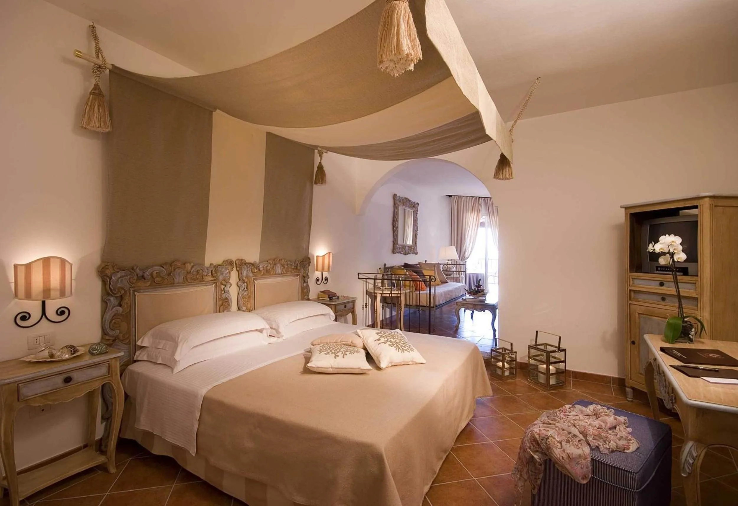 Photo of the whole room, Bed in COLONNA GRAND HOTEL CAPO TESTA, a Colonna Luxury Beach Hotel, Santa Teresa Sardegna