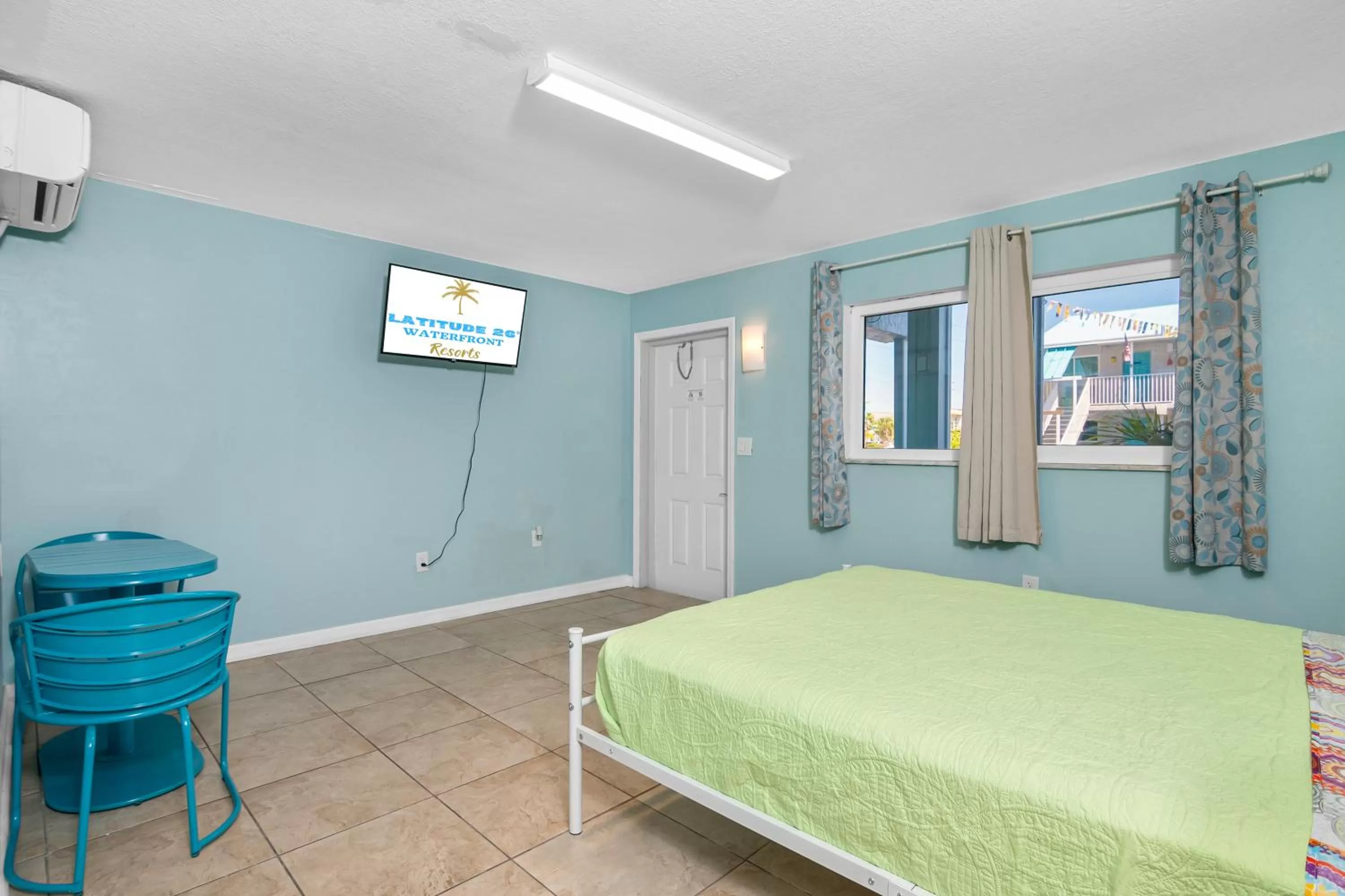 Bed in Latitude 26 Waterfront Resort and Marina
