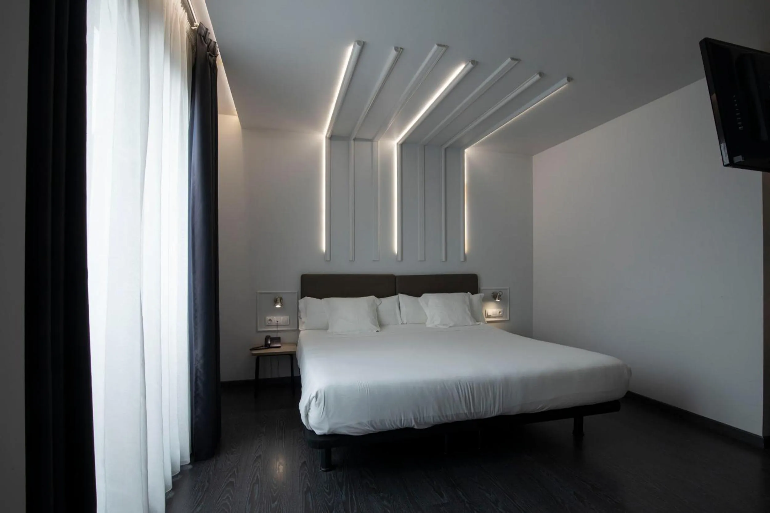 Photo of the whole room, Bed in Hotel Lux Santiago