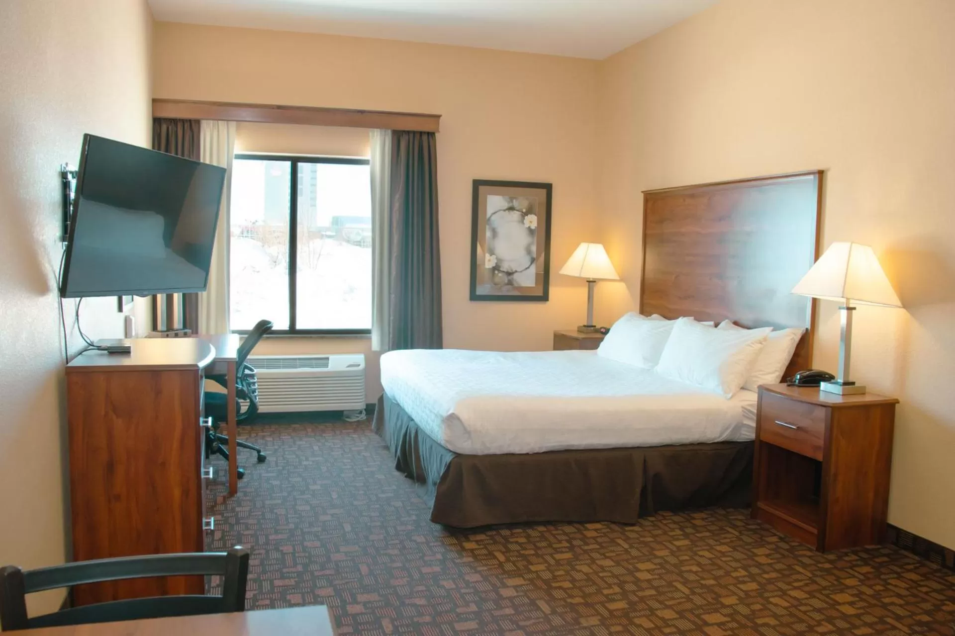 Bed in Grand Forks Lodge and Suites