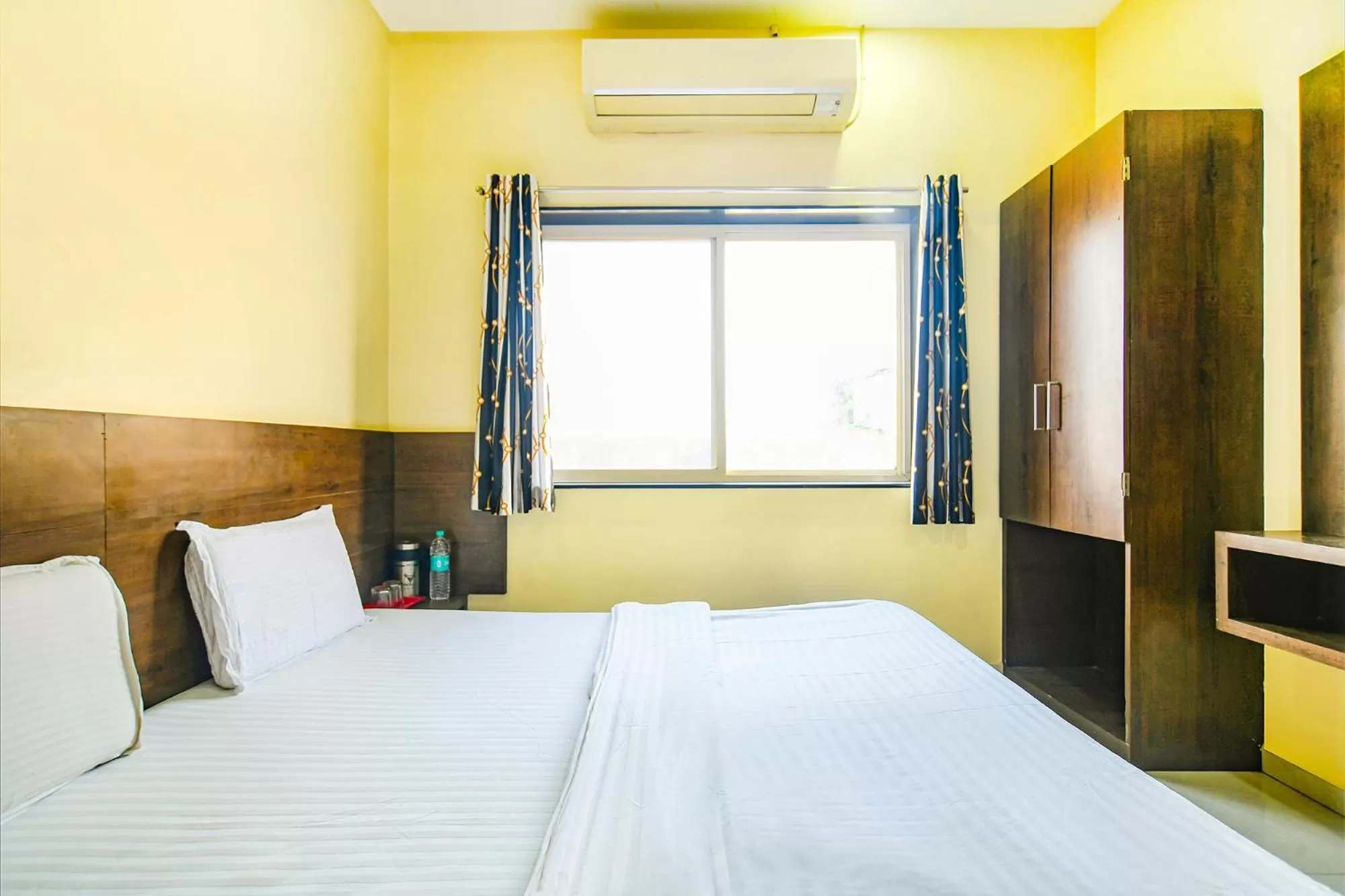 Bed in FabHotel Satyug Jaisinghpura