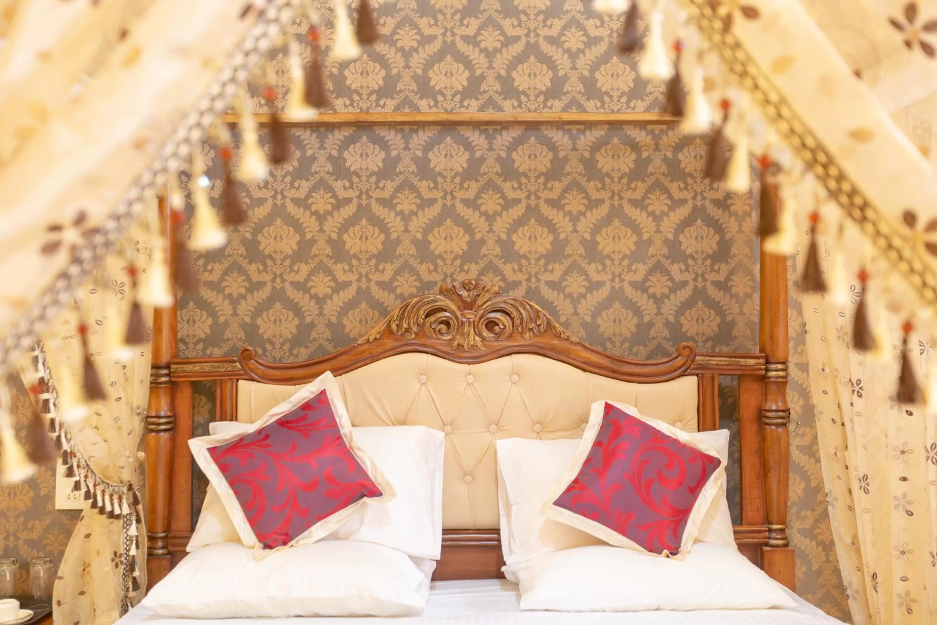 Bed in KSTDC Hotel Mayura Krishna Almatti