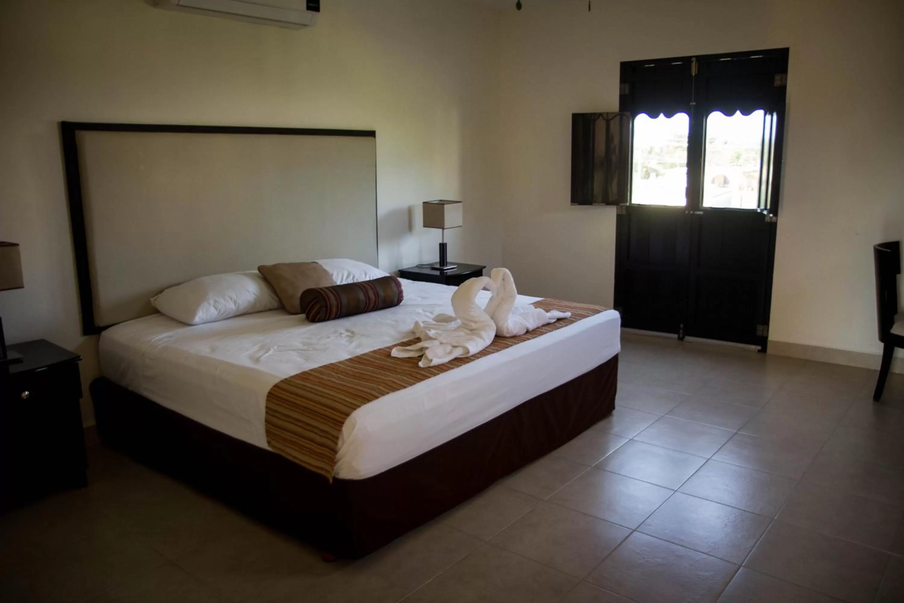 Bed in Hotel Hacienda de Izamal