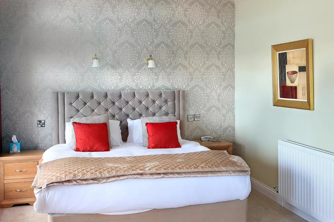 Bed in The Marine Hotel