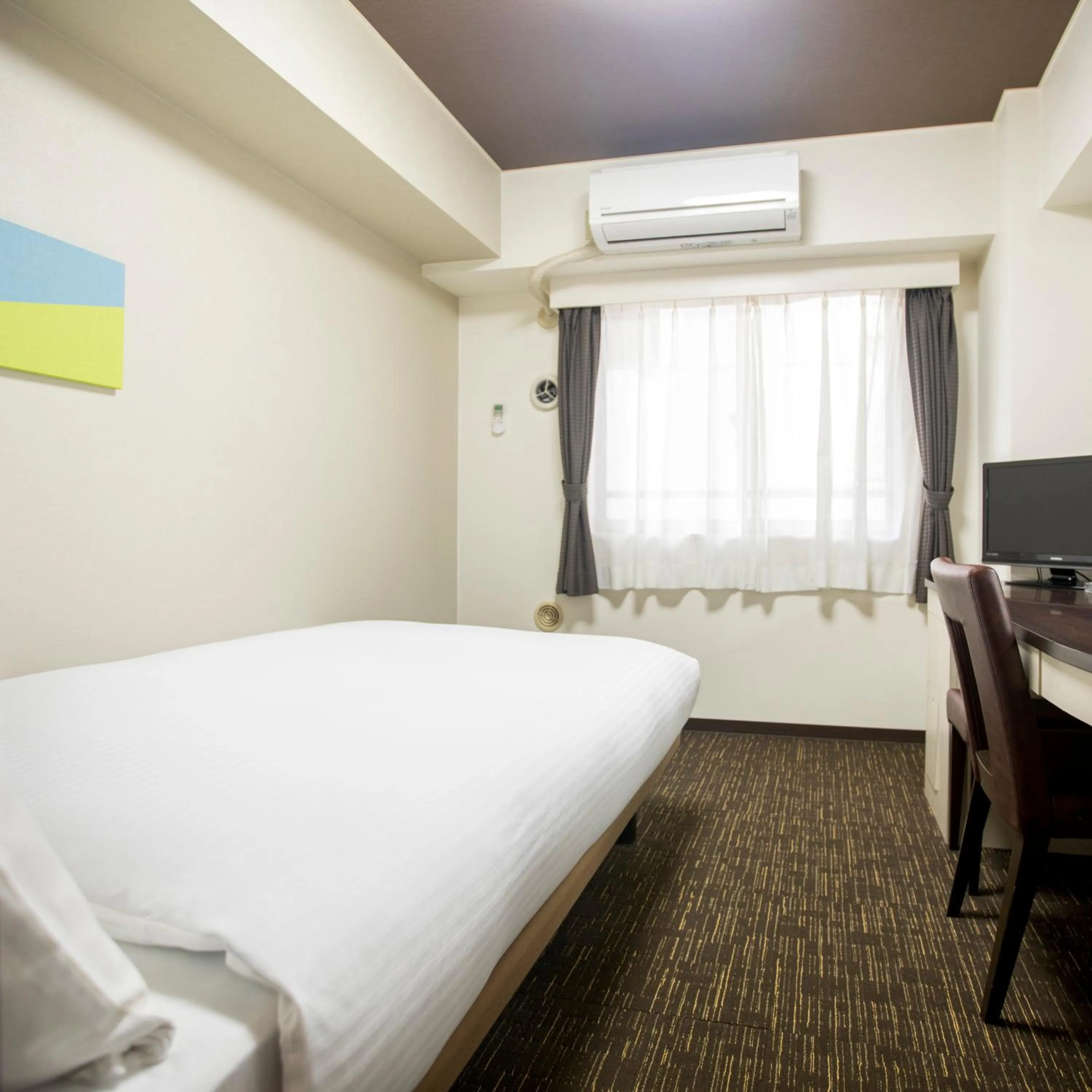 Bed in FLEXSTAY INN Kawasaki Kaizuka