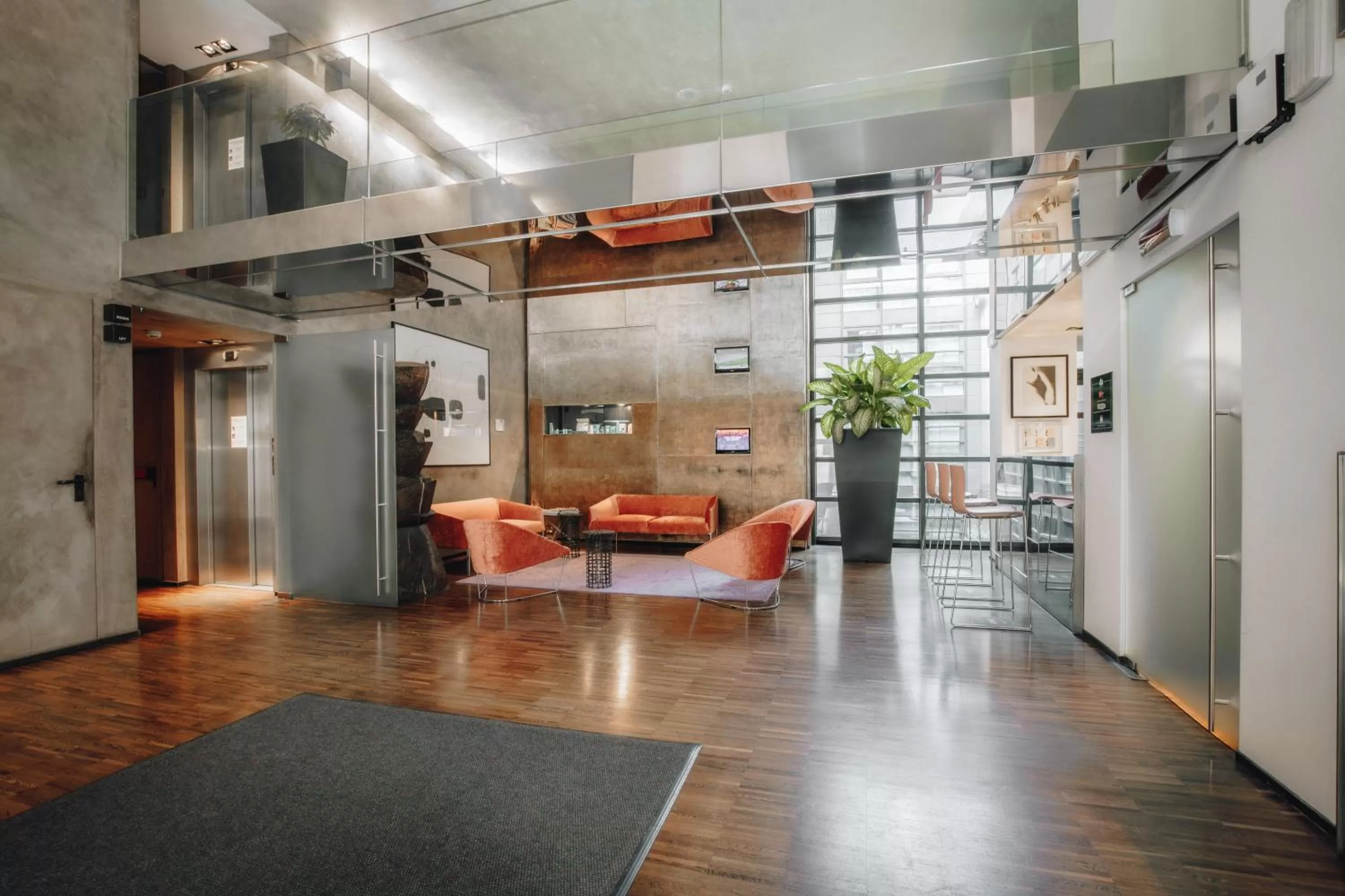 Communal lounge/ TV room in DelleArti Design Hotel