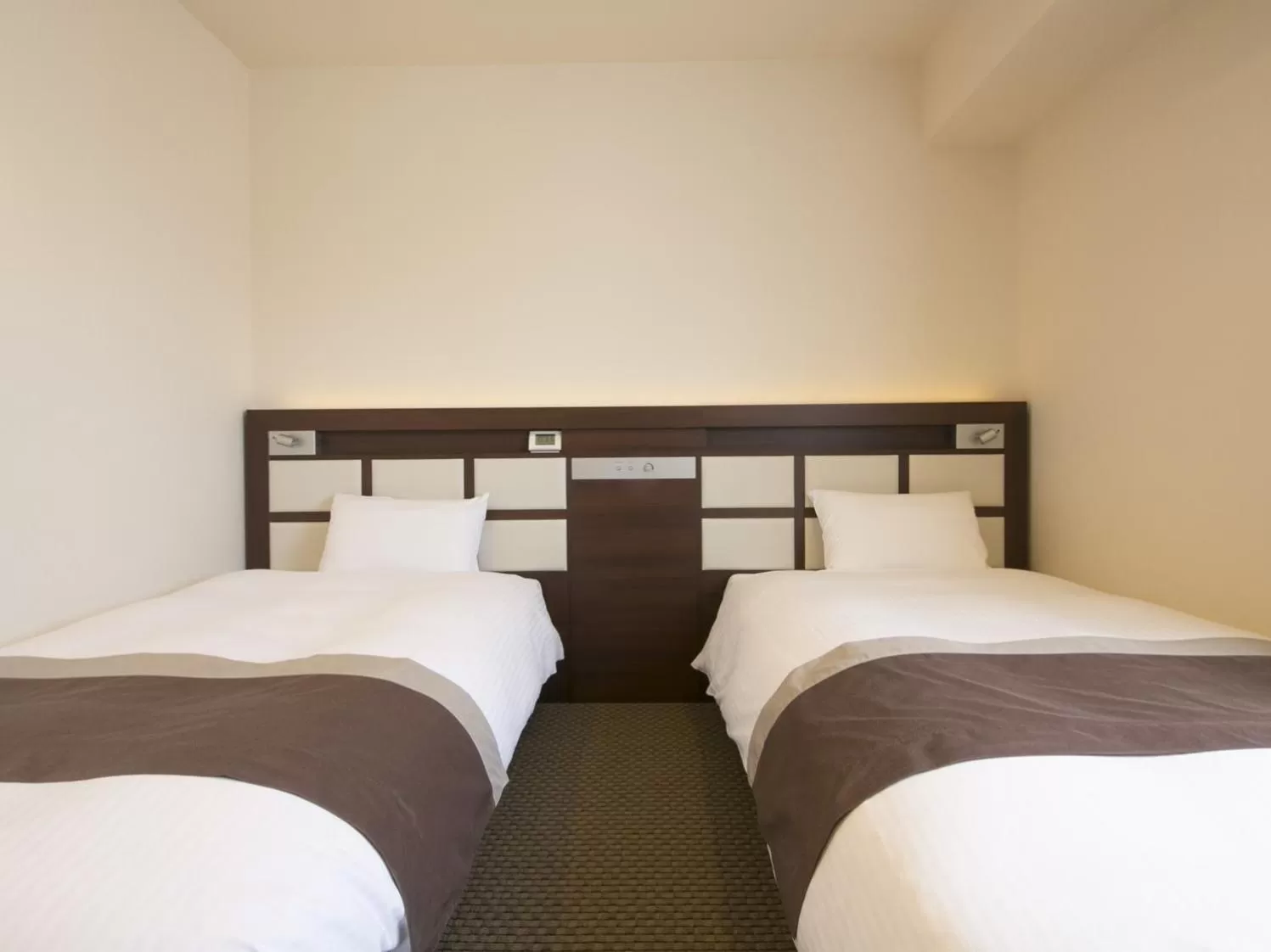 Bed in Urban Hotel Minami Kusatsu