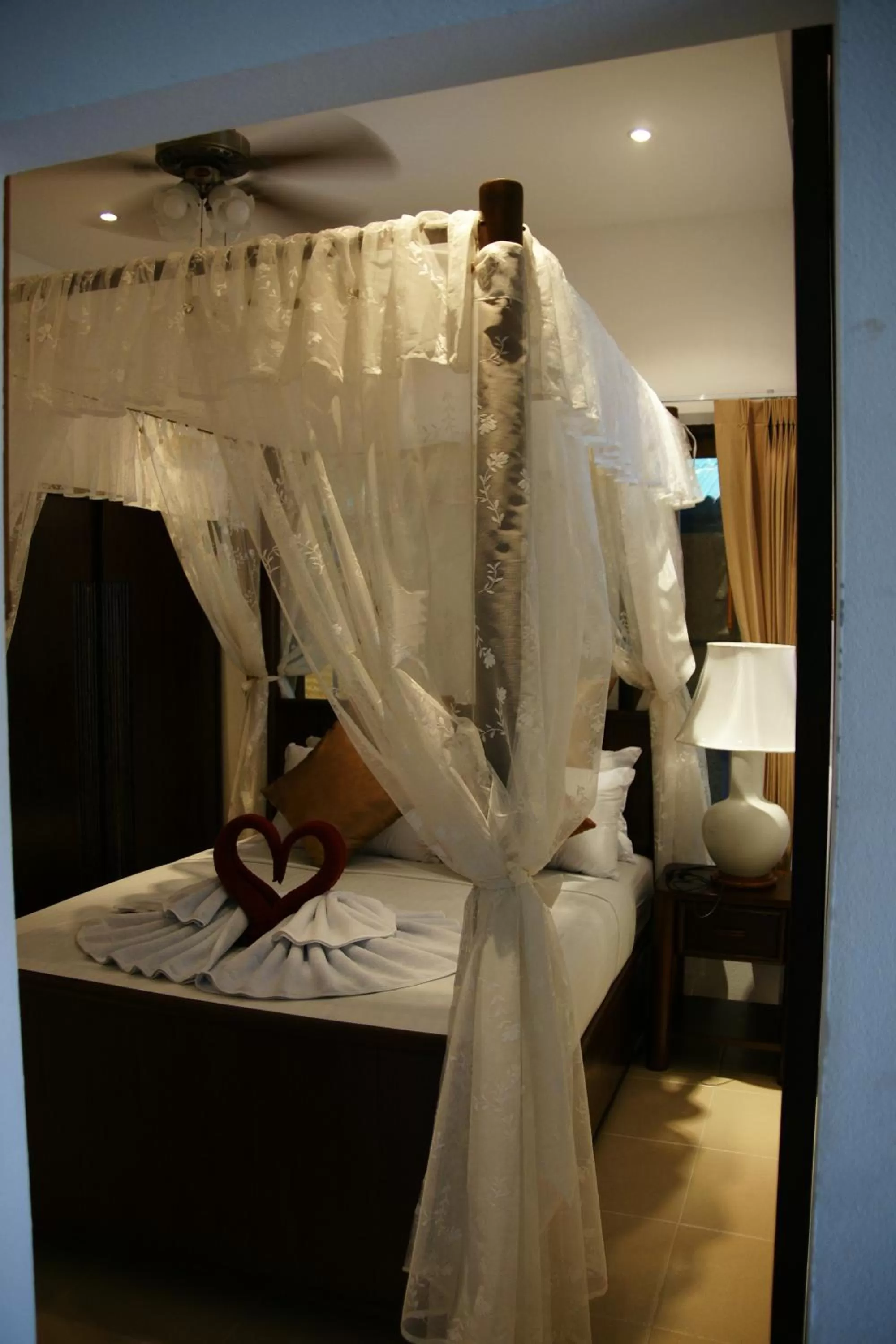 Bed in Jungle Village Bungalow