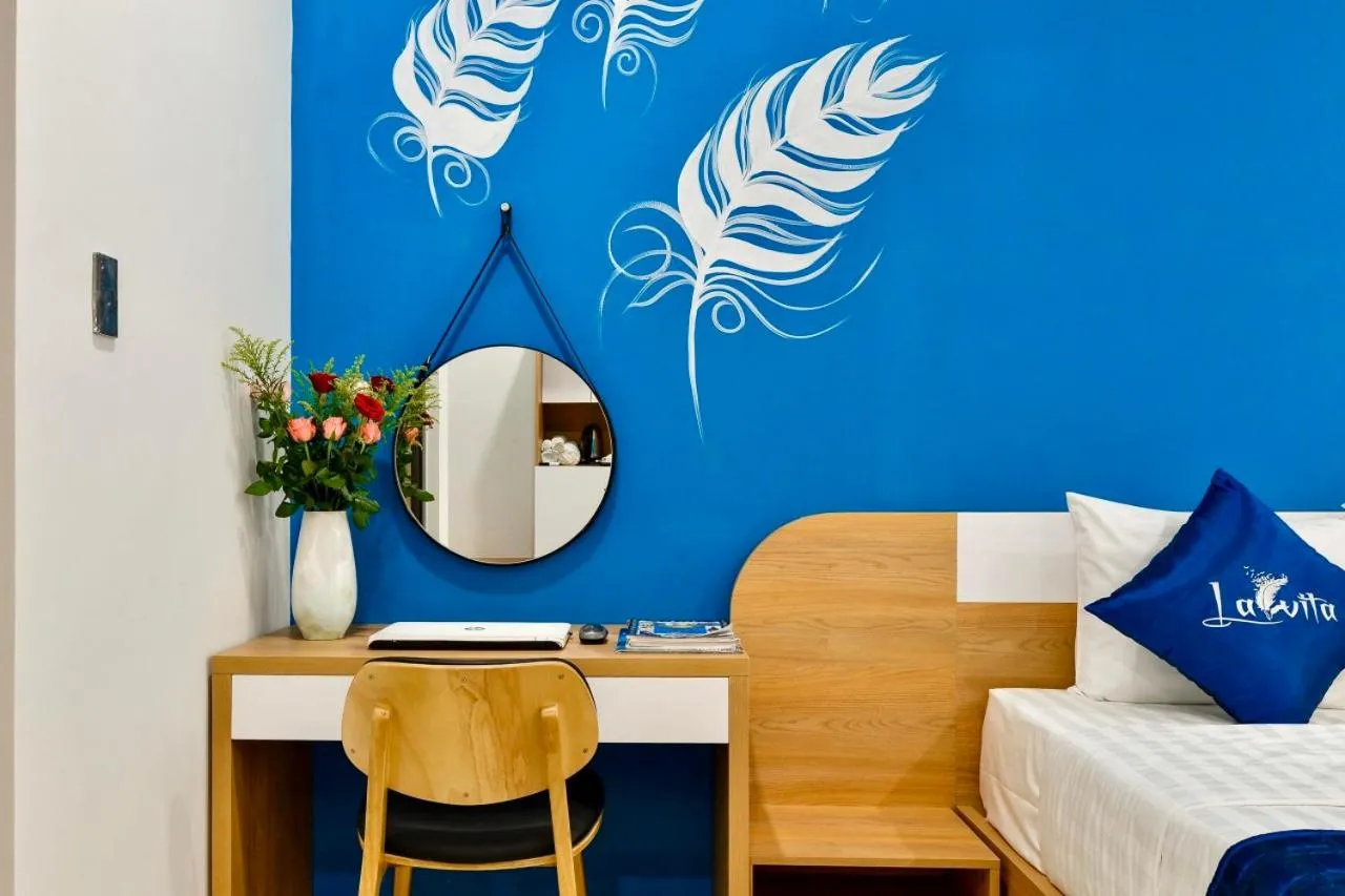 Seating area, Bed in La Vita Hotel