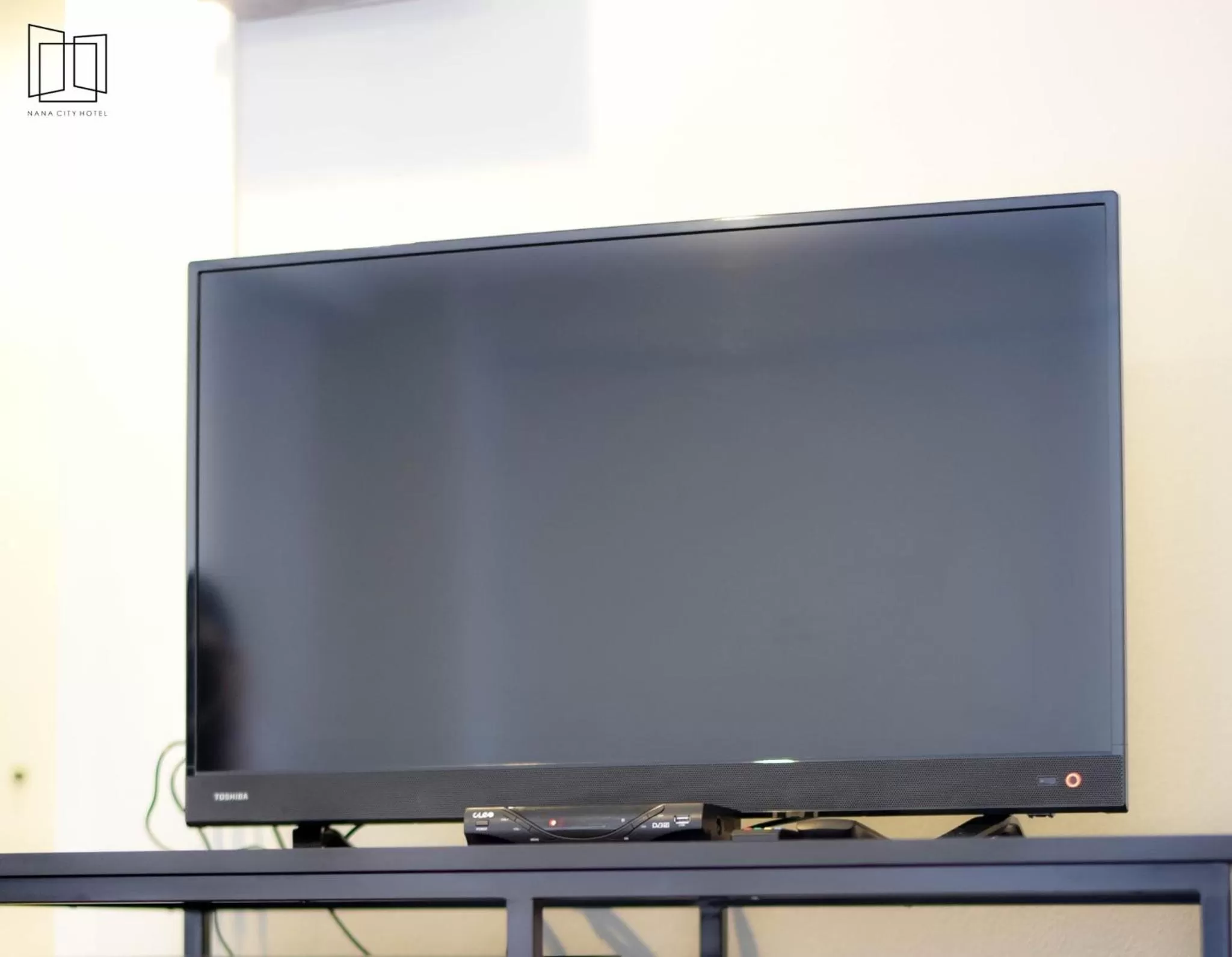 TV/Entertainment Center in Nana City Hotel