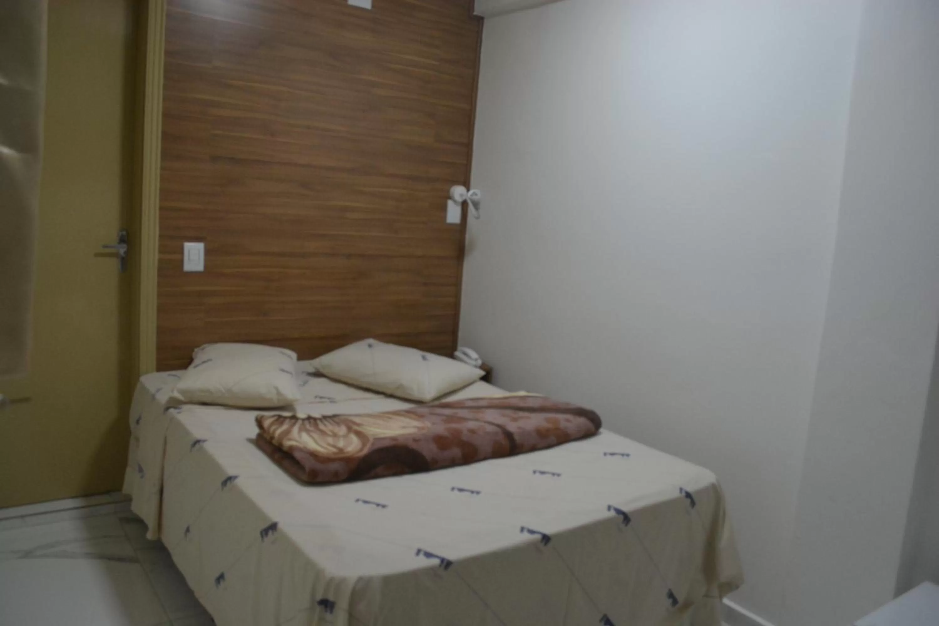 Bed in New Point Hotel