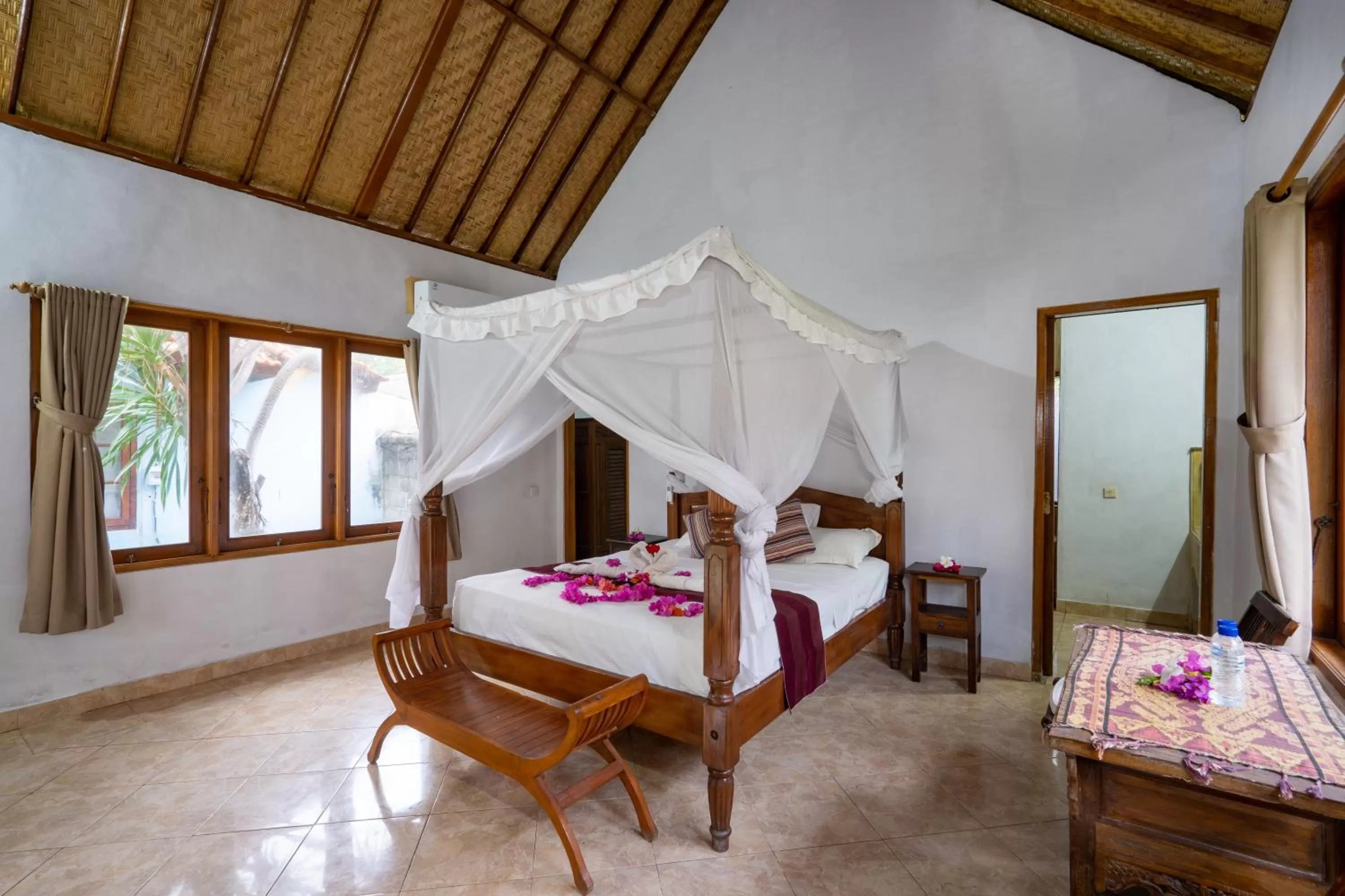 Bed in Mushroom Beach Bungalows