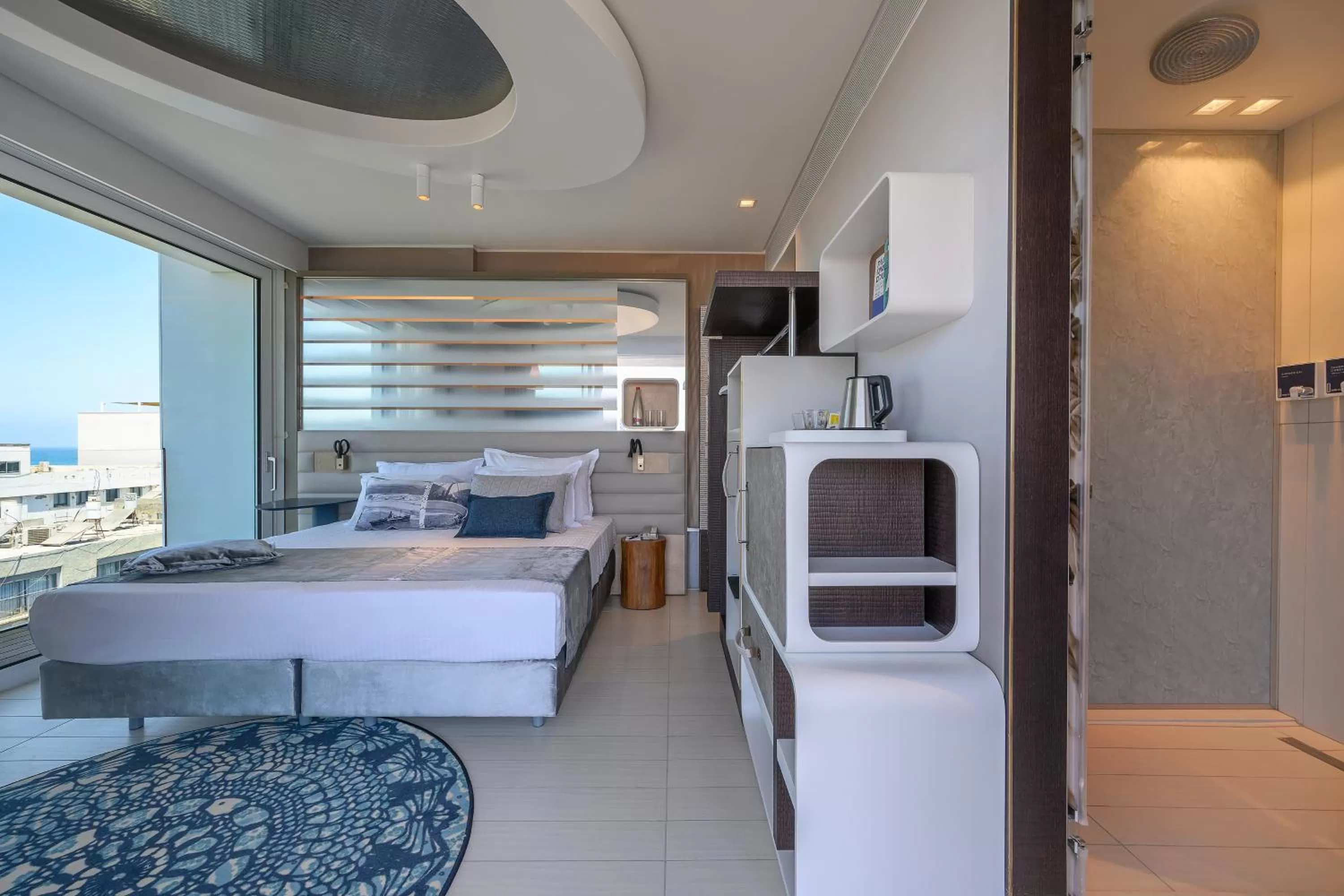 Photo of the whole room, Bed in Port Tower by Isrotel Design