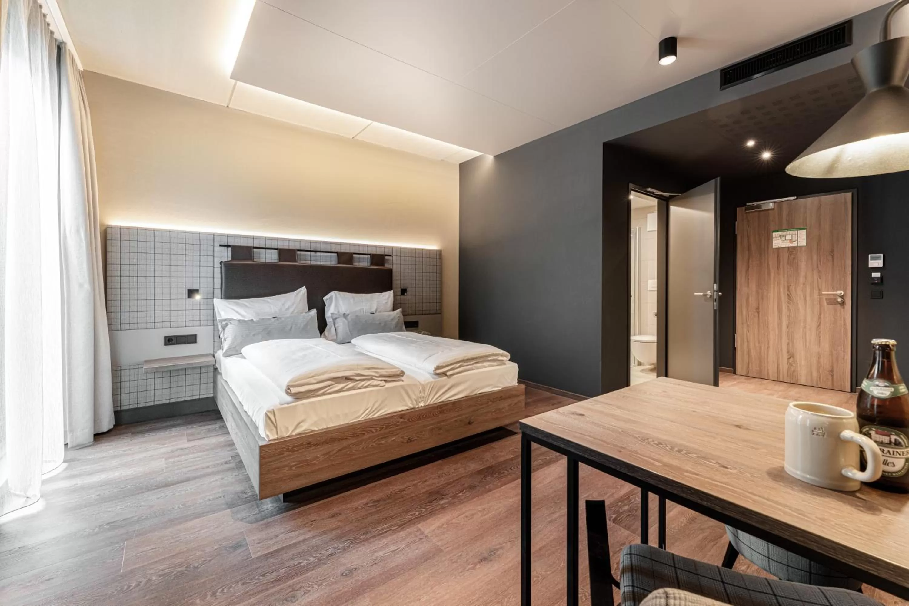 Bed in FreshSuites & Bar