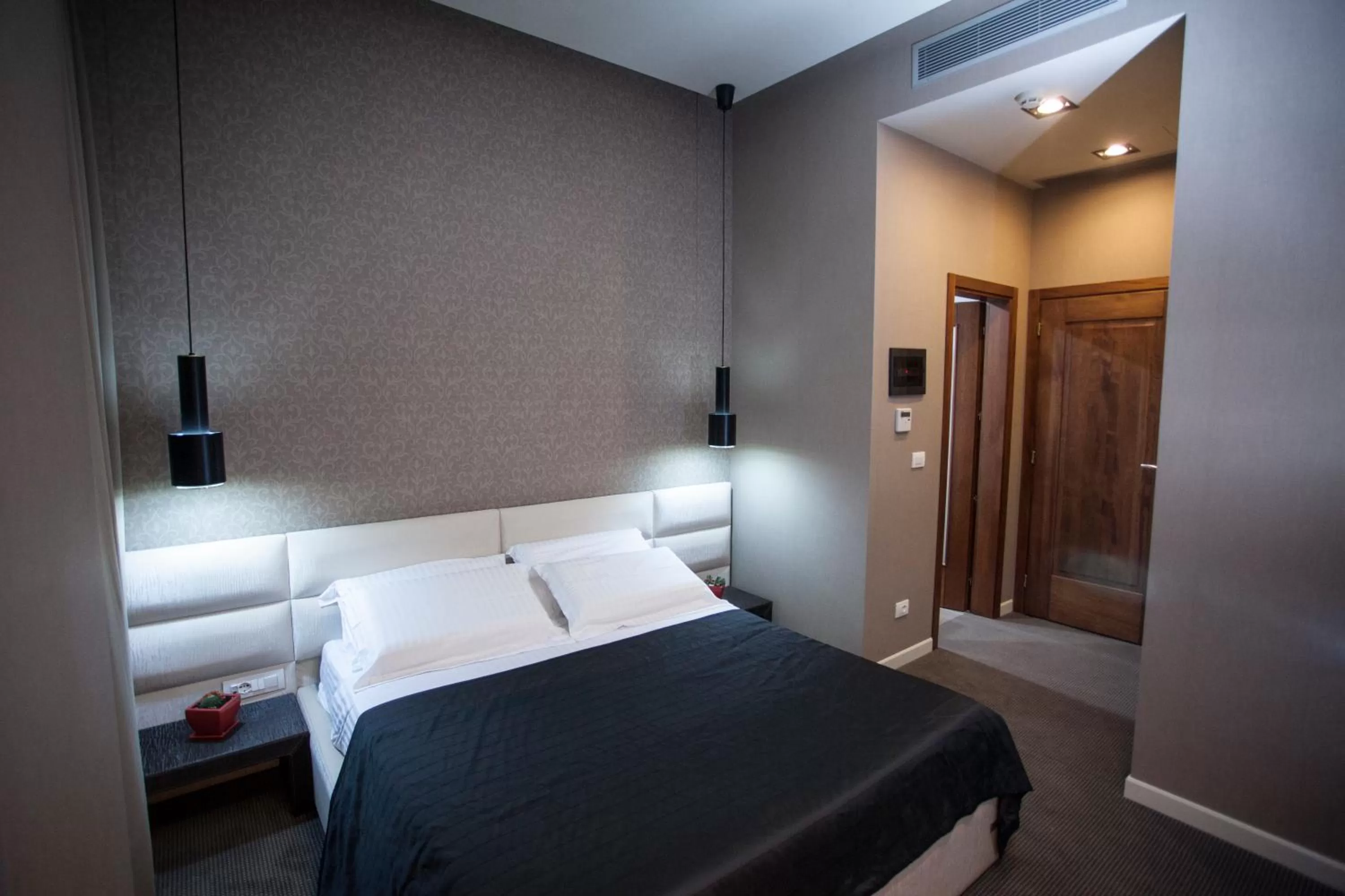 Bed in La Bohème Hotel