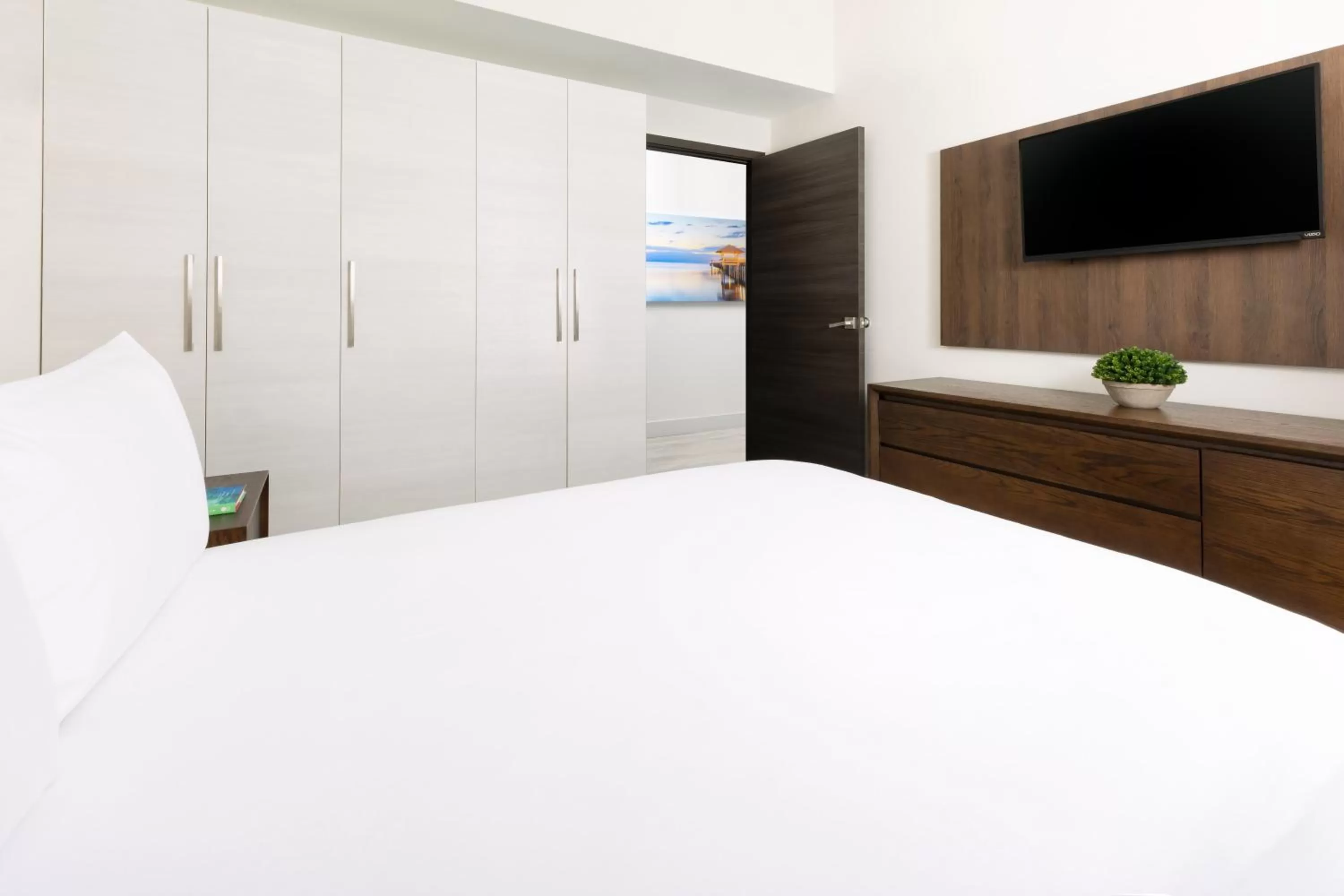 Bed in Costa Hollywood Beach Resort - An All Suite Hotel