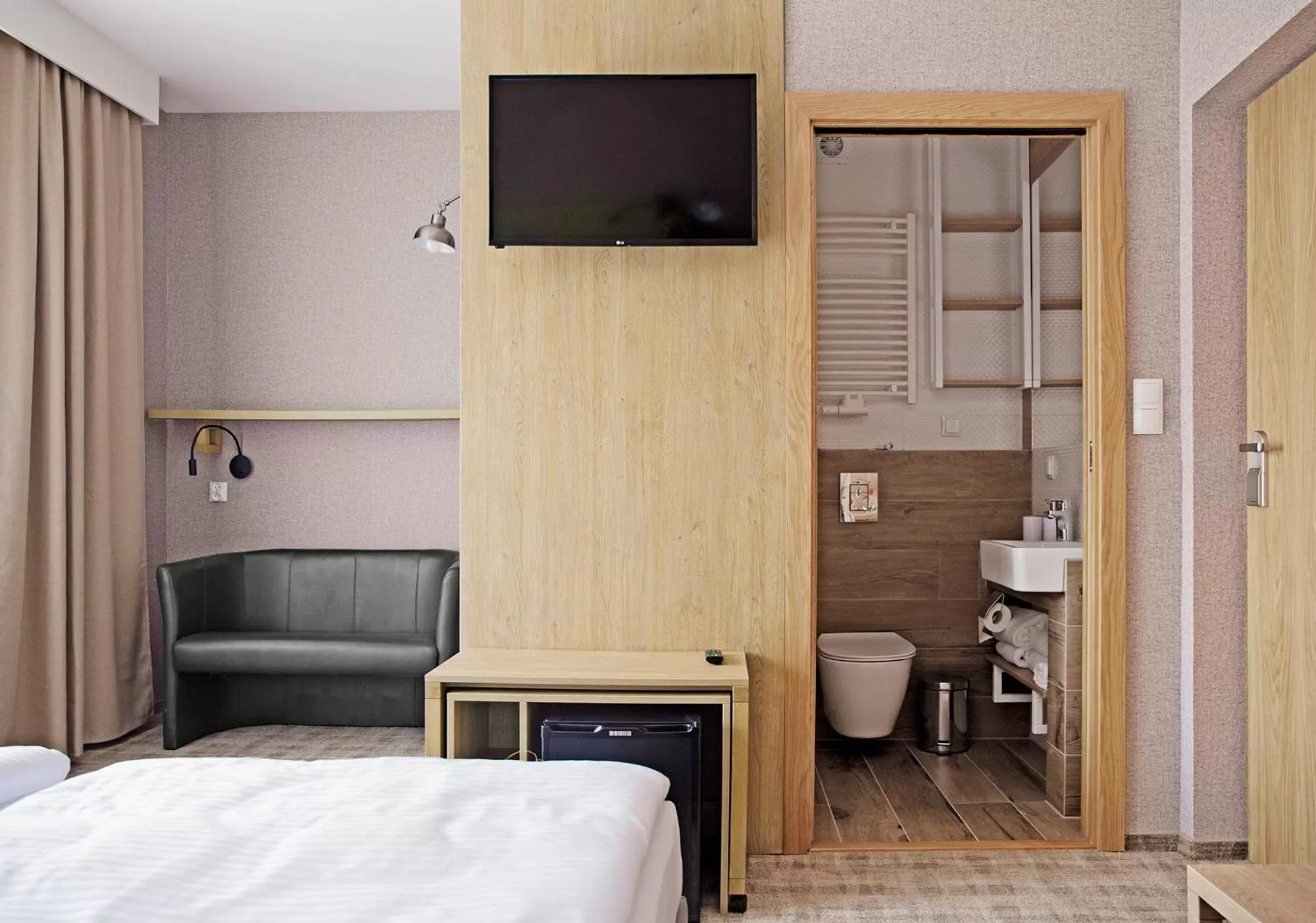 Communal lounge/ TV room, Bed in Dom Wczasowy Beskidy