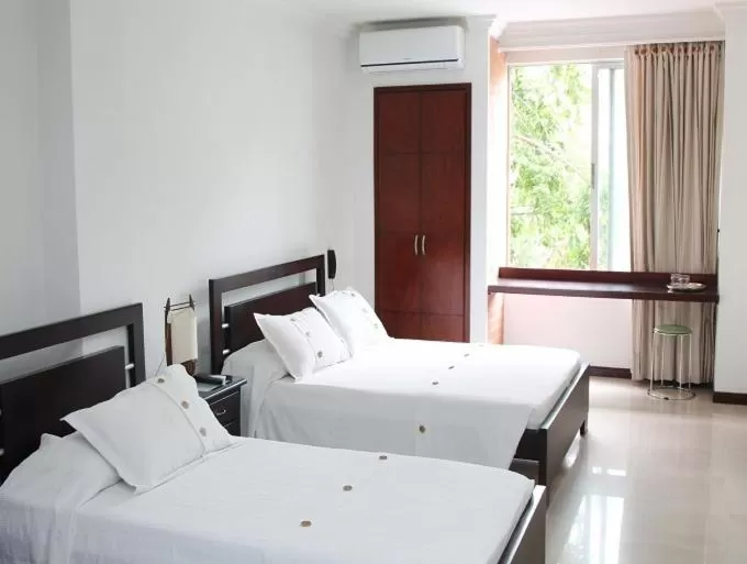 Bed in Pampalinda Hotel